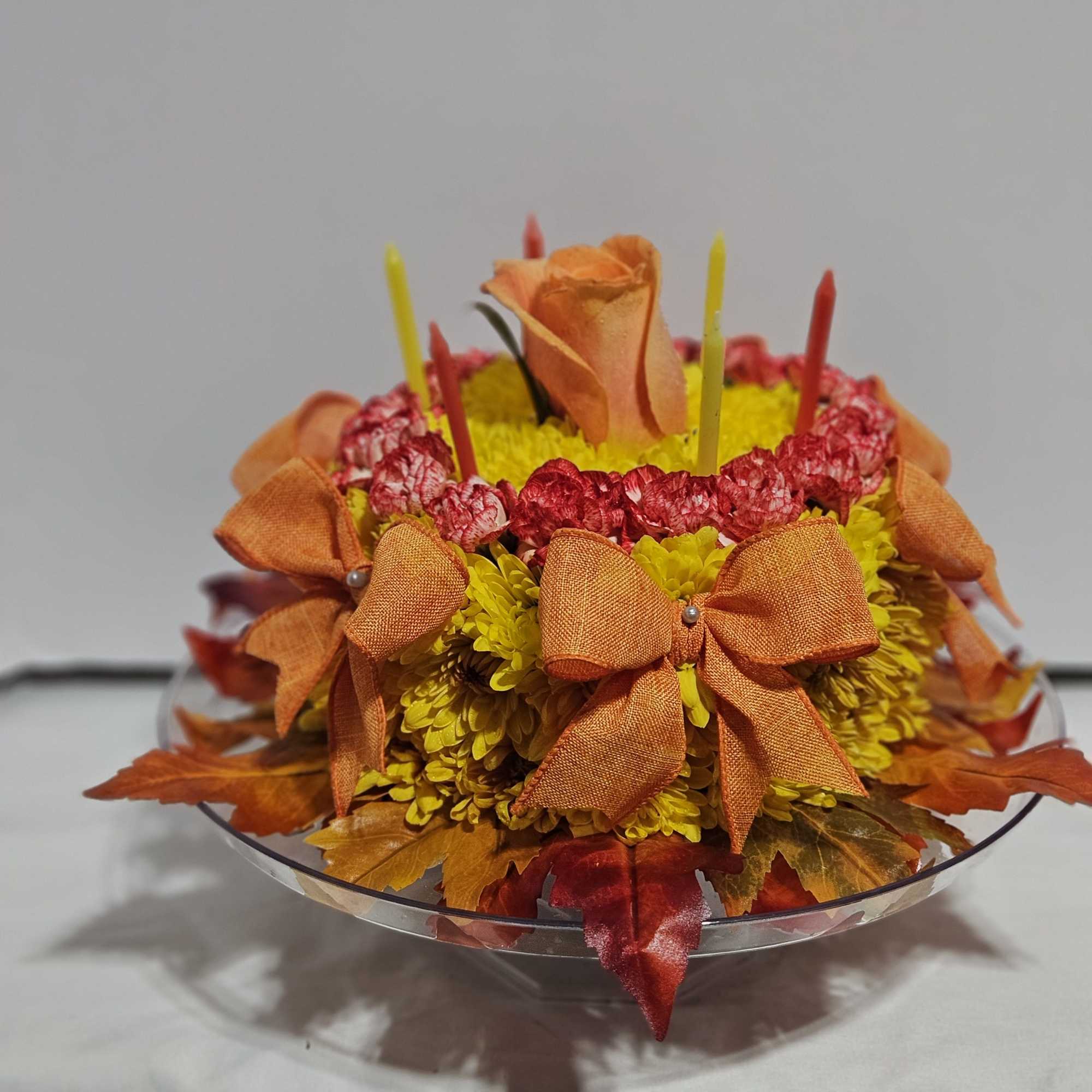 We've given our  birthday cake arrangement a sweet new look. This
