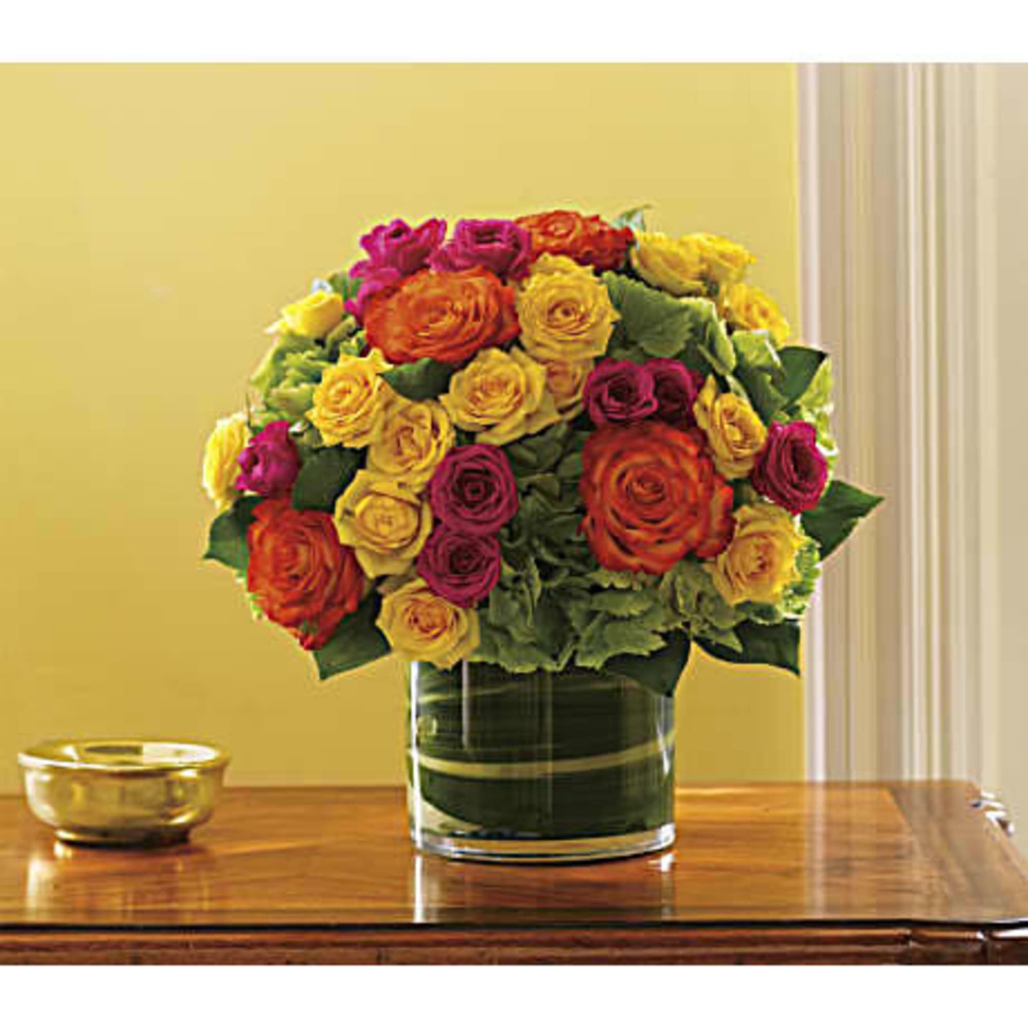 Bright green hydrangea and rich green salal leaves mix with hot pink