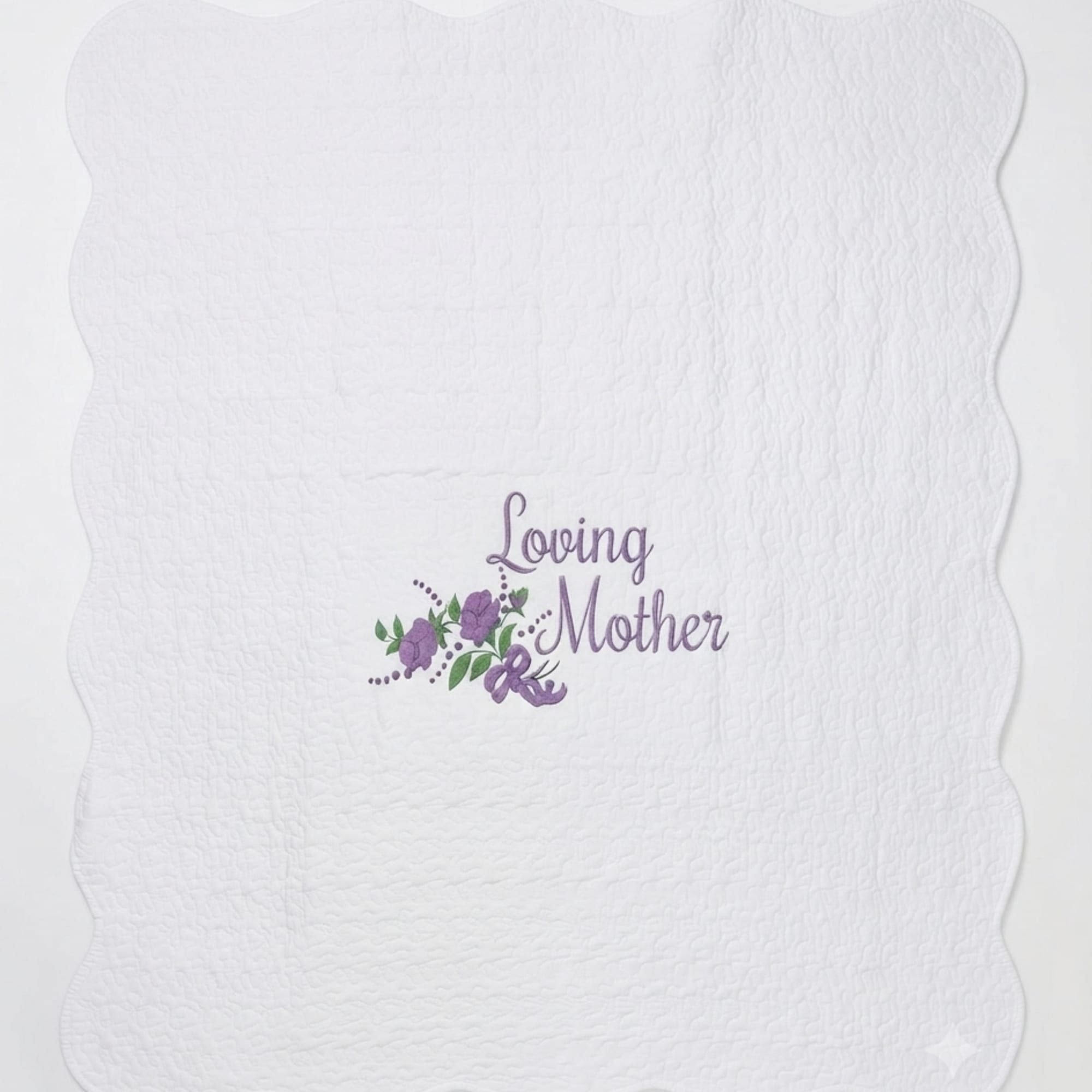 White quilted blanket with a purple "Loving Mother" floral design