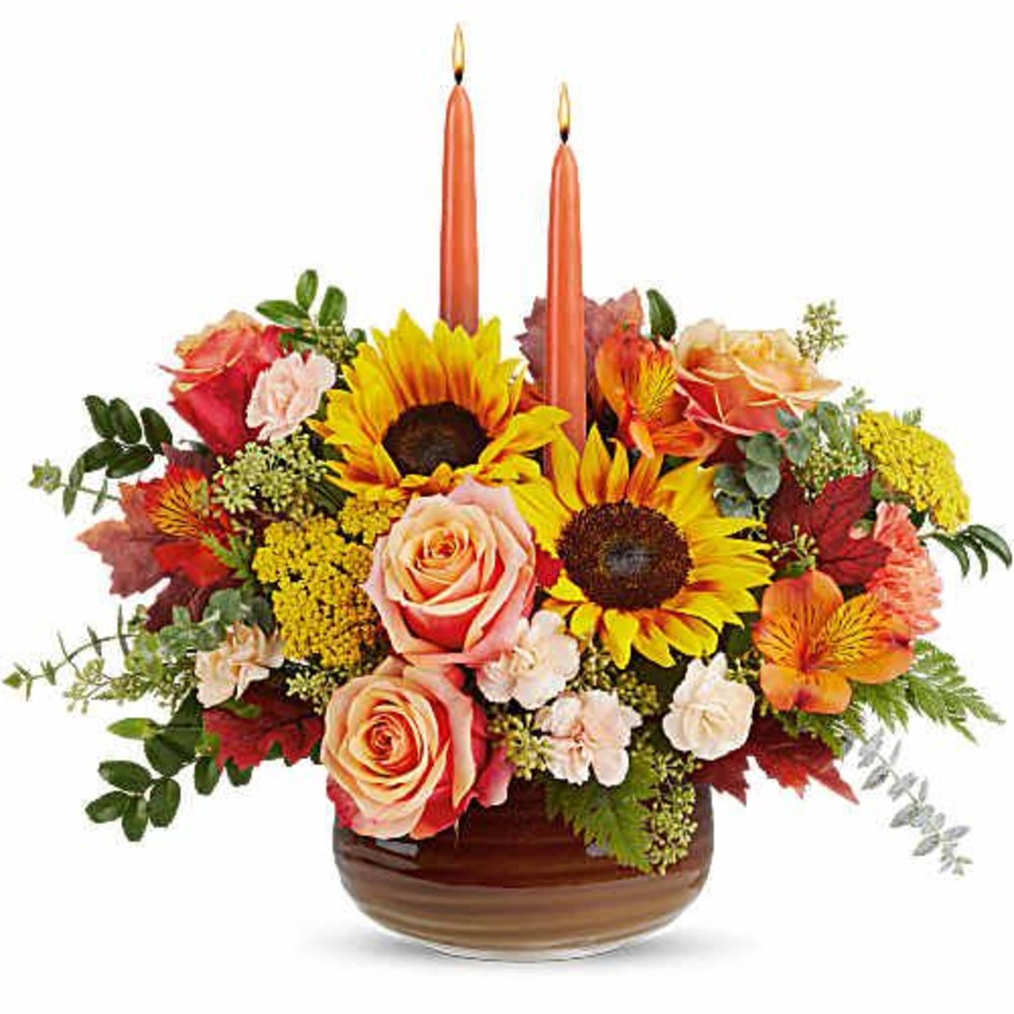 Teleflora's Fall's Harvest Centerpiece glows with radiant sunflowers, rich autumn blooms, and