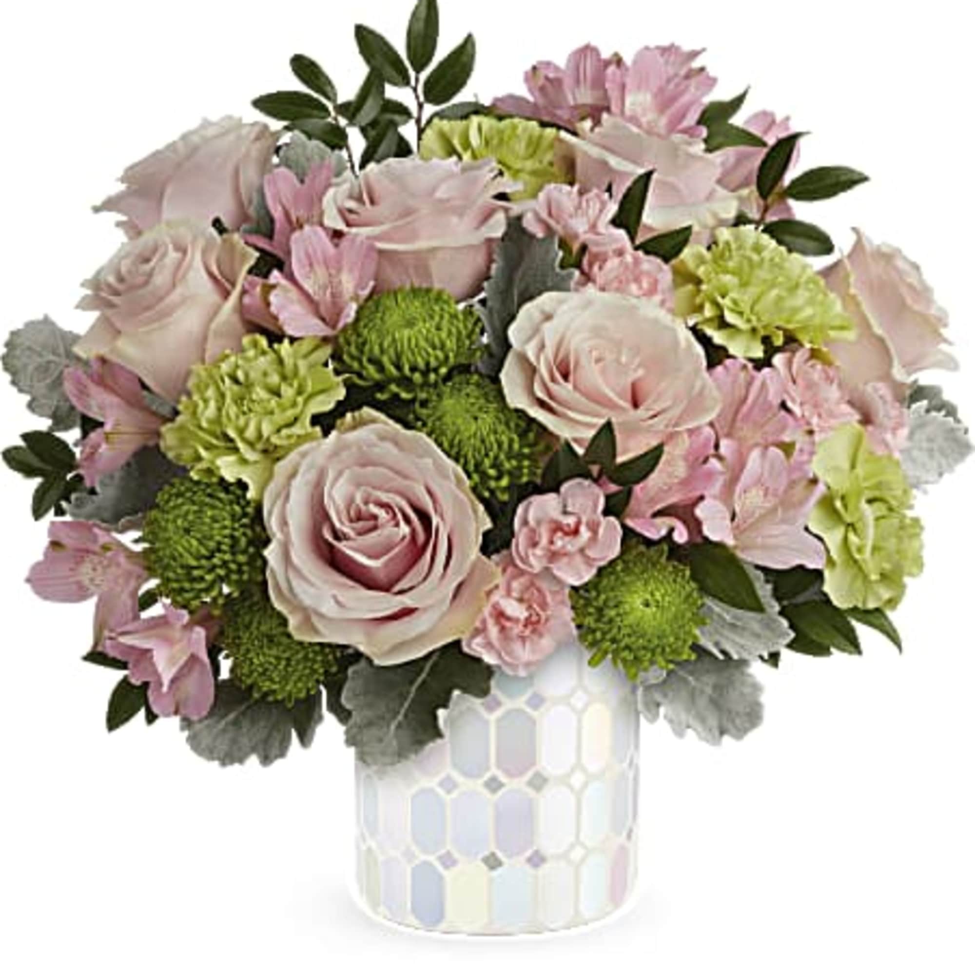 Embrace timeless elegance with Teleflora's Alluring Mosaic cylinder, radiating soft pastel shimmer