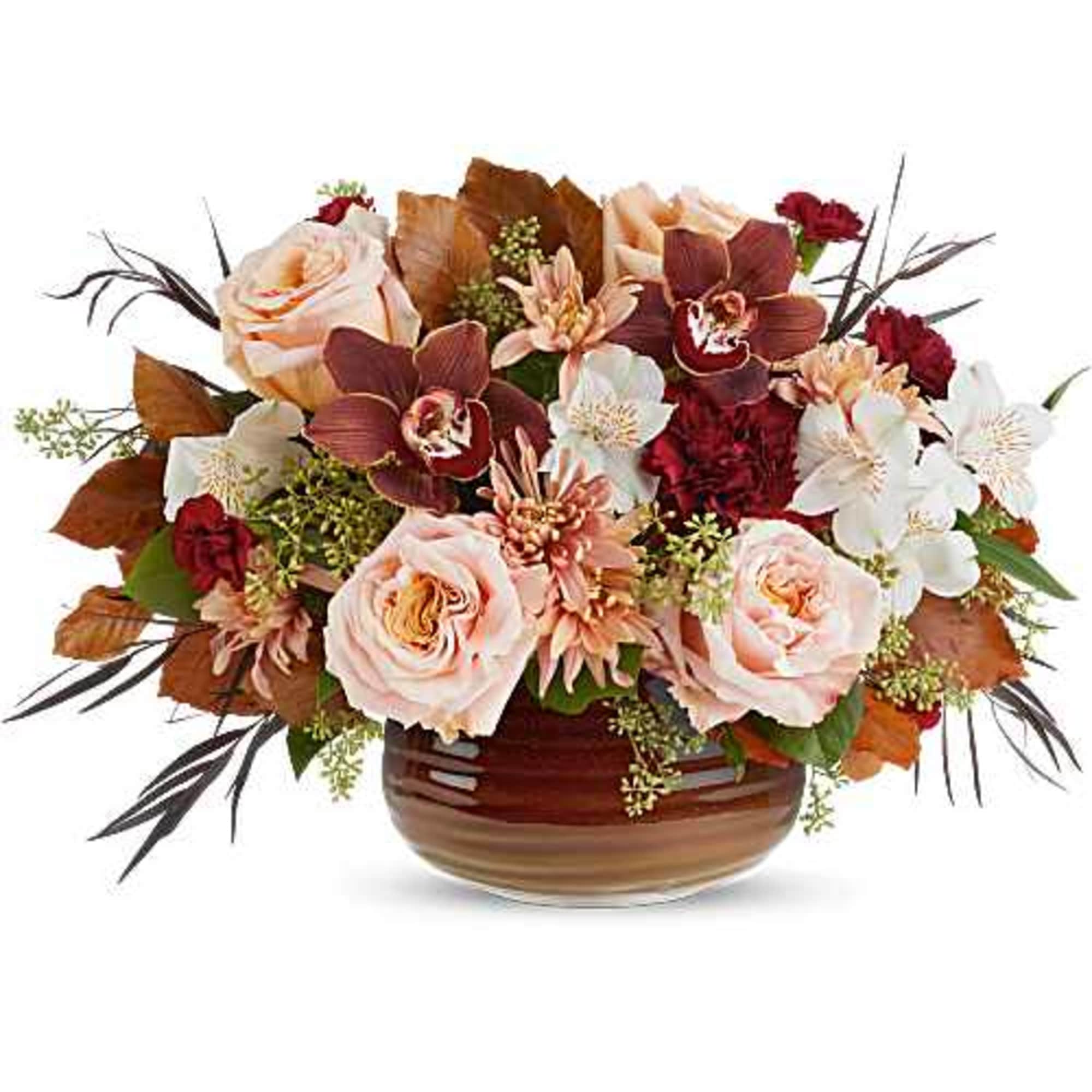 Teleflora's Sunset Stone Centerpiece glows with rich reds and soft peach tones
