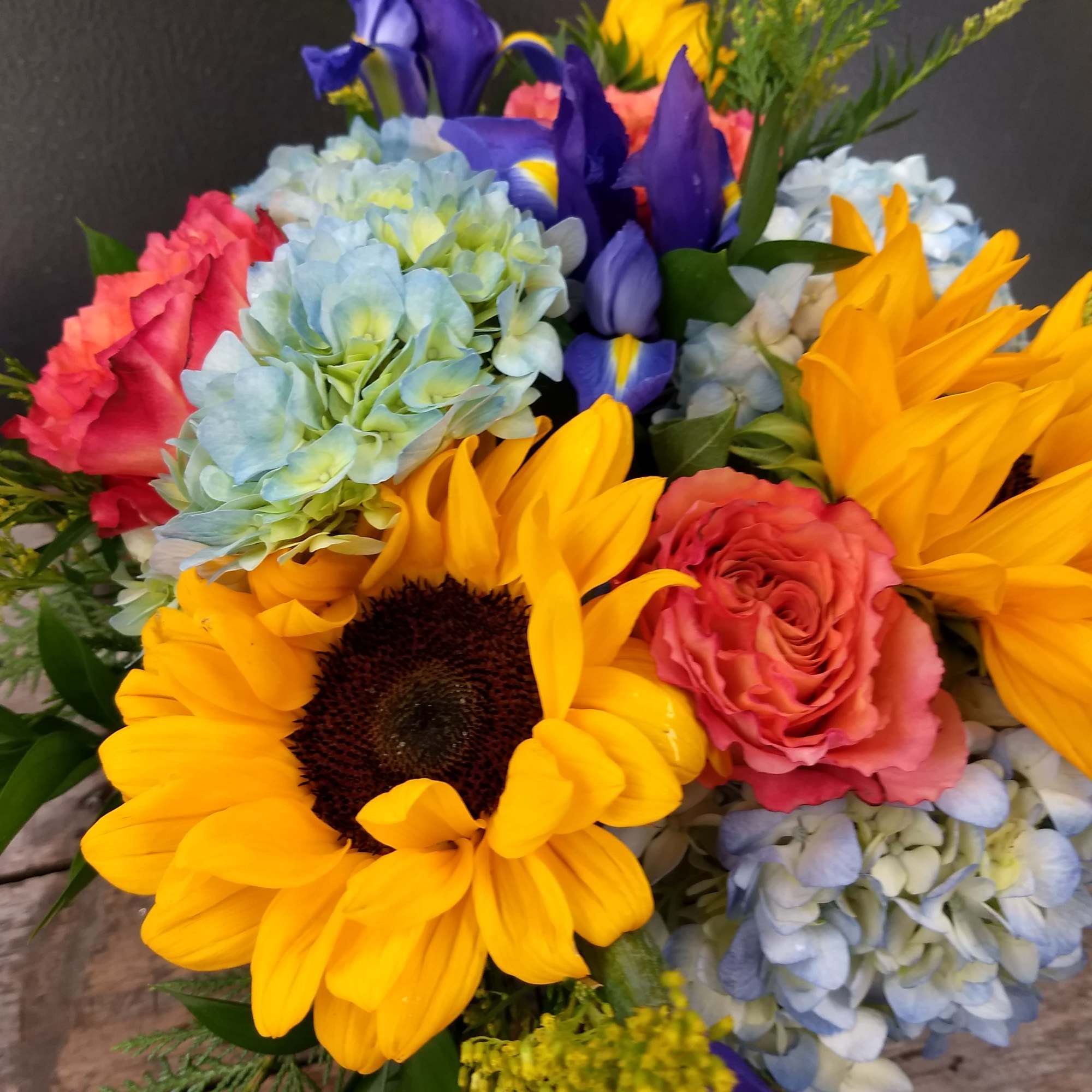 Big golden sunflowers take center stage in this cheerful flower arrangement, making, photo 2 of 2