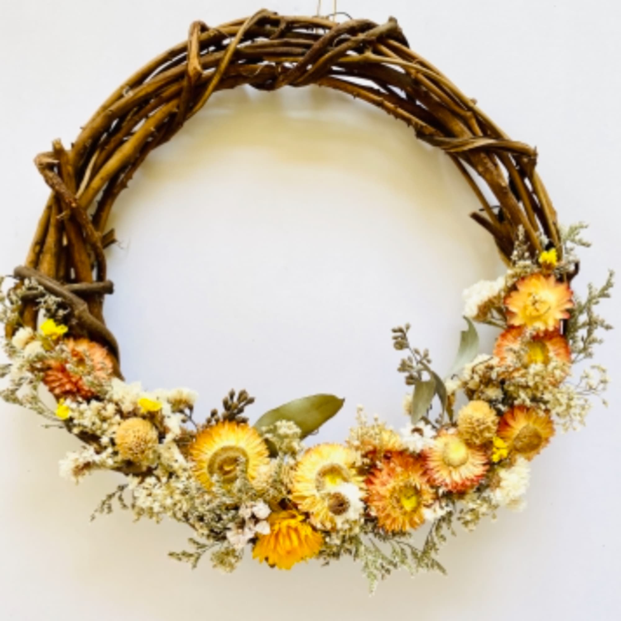 Dried flower wreath on a twisted twig ring