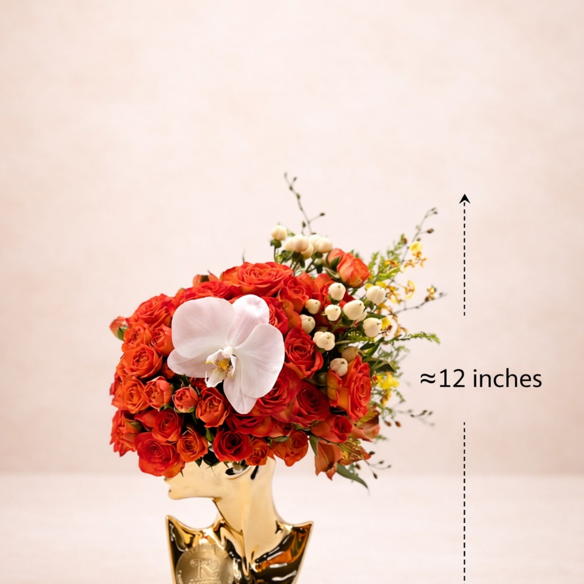Orange rose arrangement with a white orchid in a gold vase