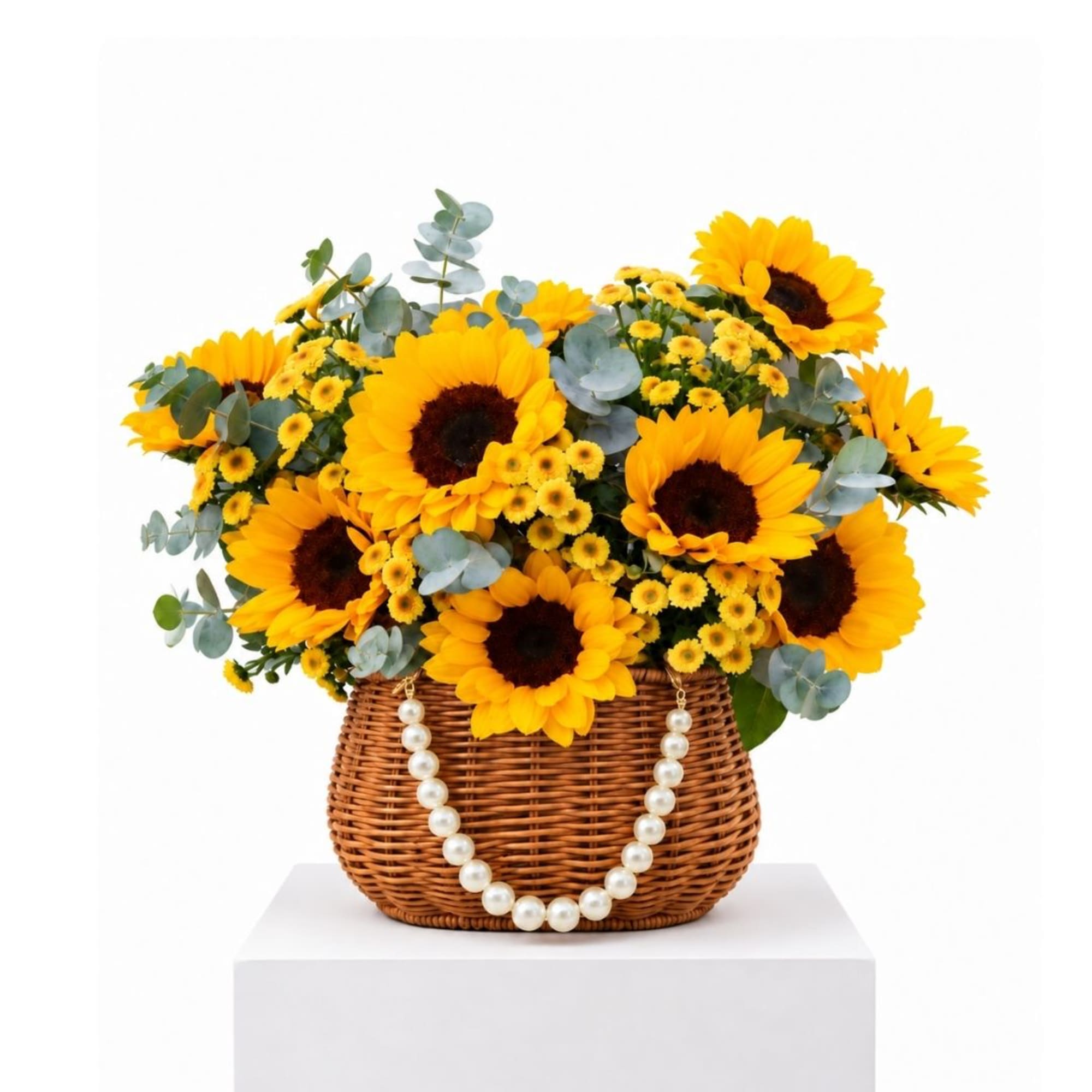 Sunflower arrangement in a wicker basket with a pearl handle