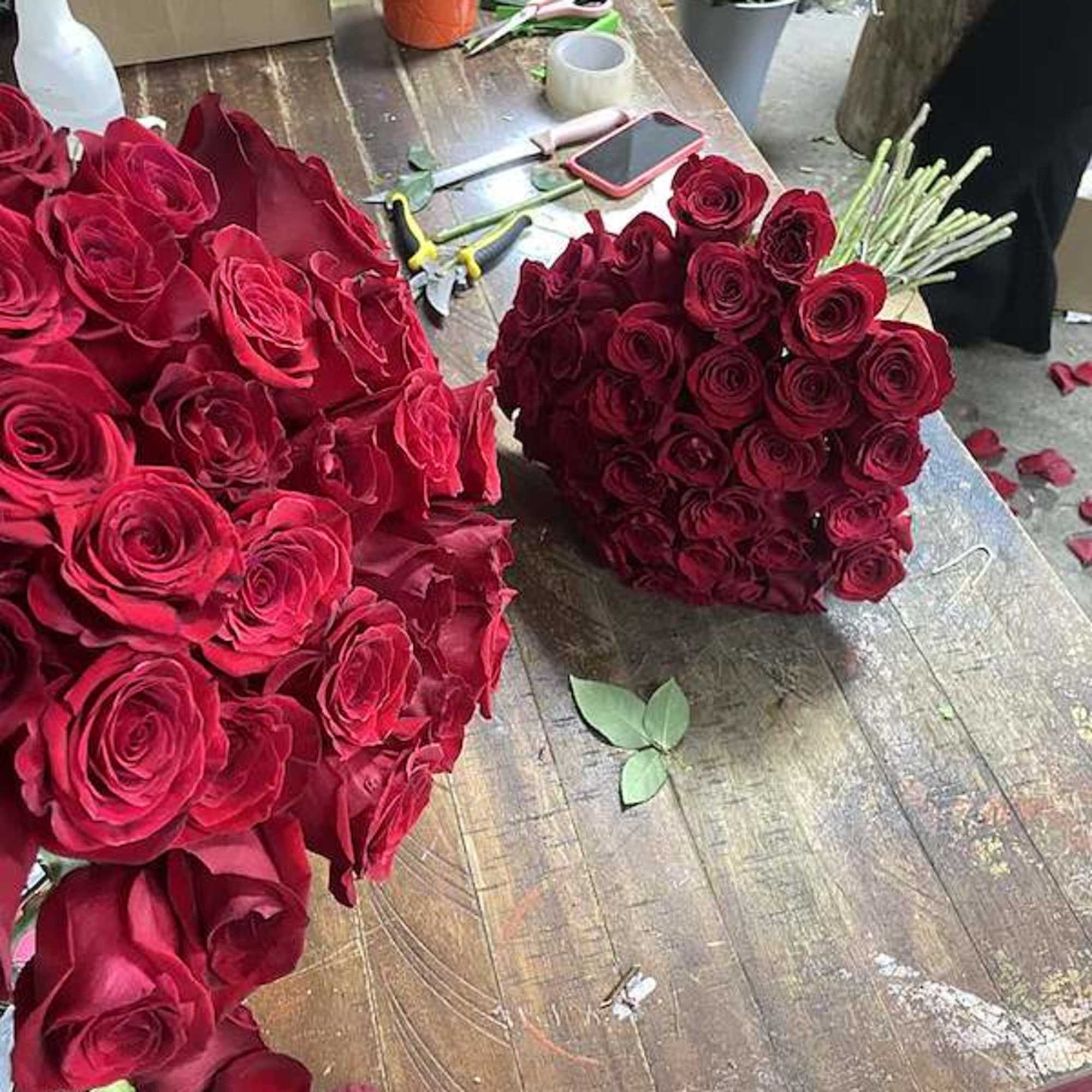 two 36 count red bouquets 
wow her with two large bouquets