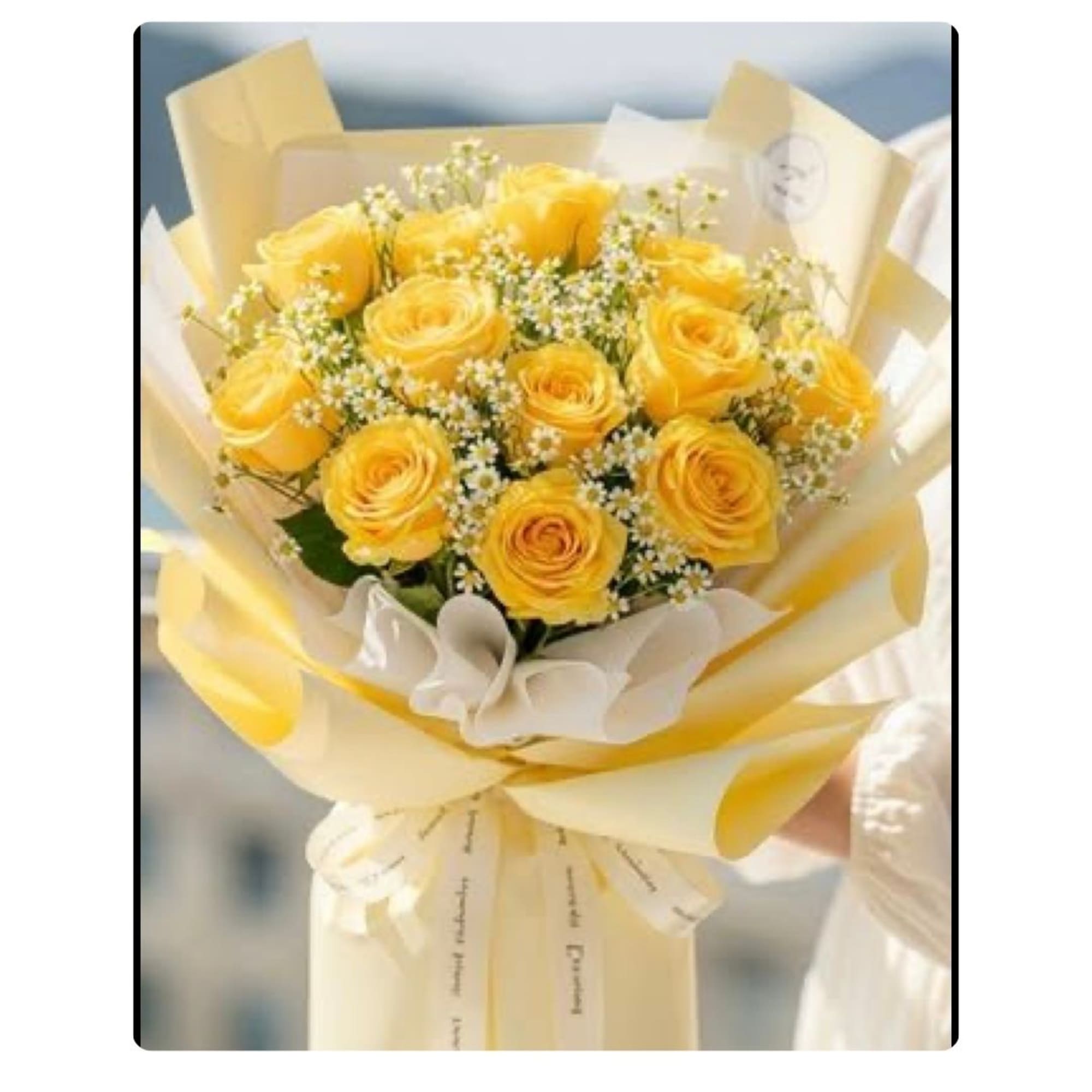 Yellow rose bouquet wrapped in cream and pale yellow paper