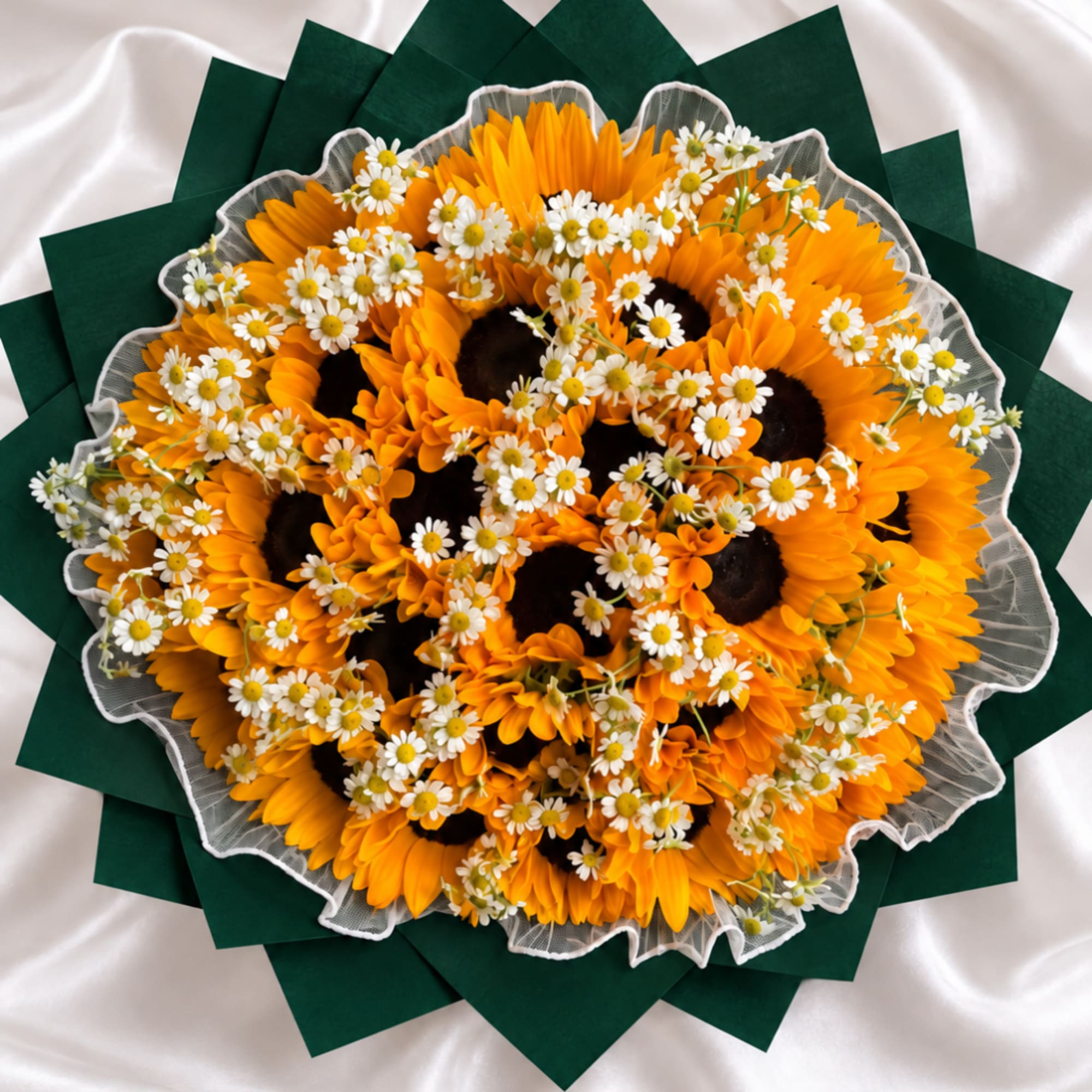 Bouquet of orange sunflowers and small white daisies wrapped in green paper
