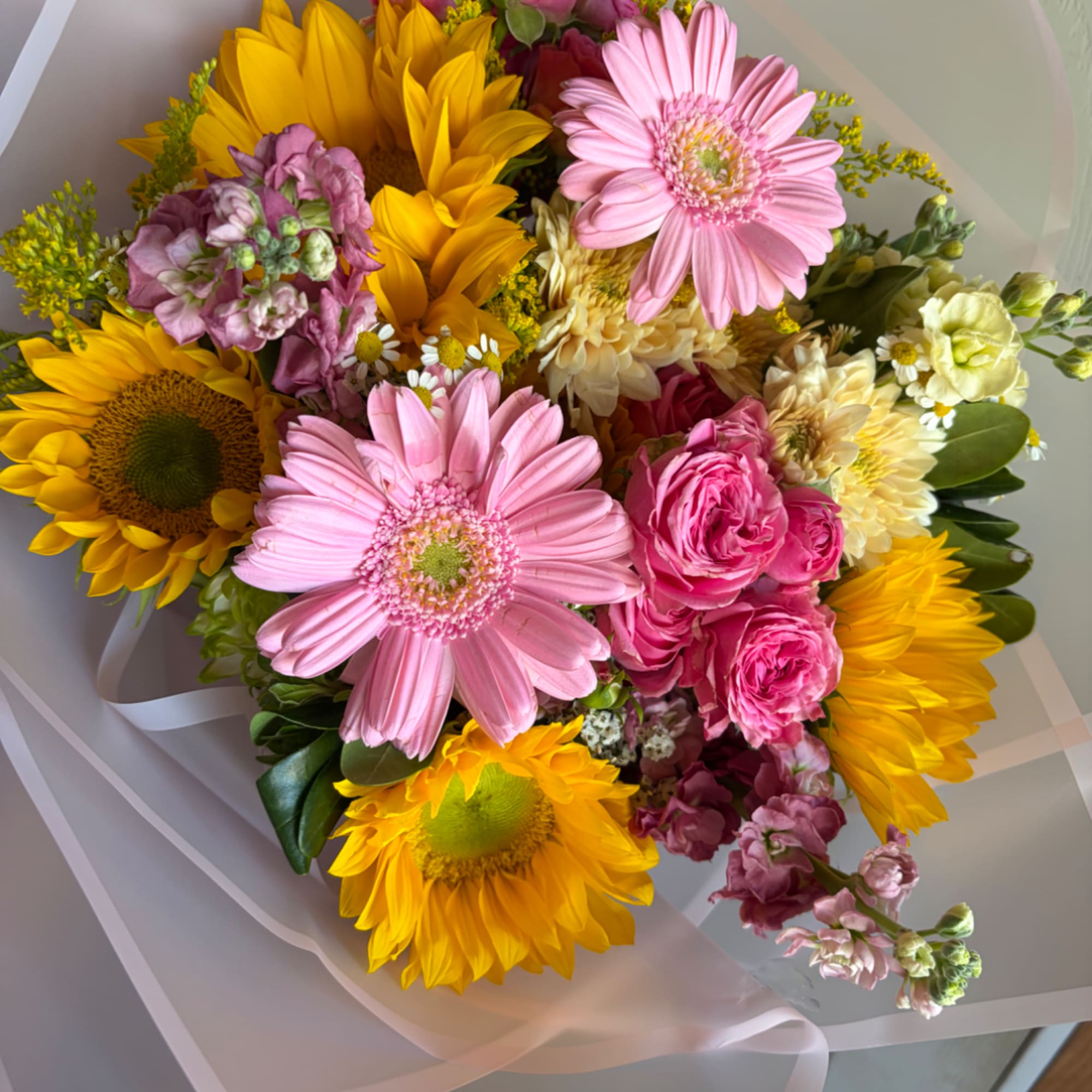 Mixed bouquet with pink gerbera daisies, yellow sunflowers, and pink roses, photo 2 of 5