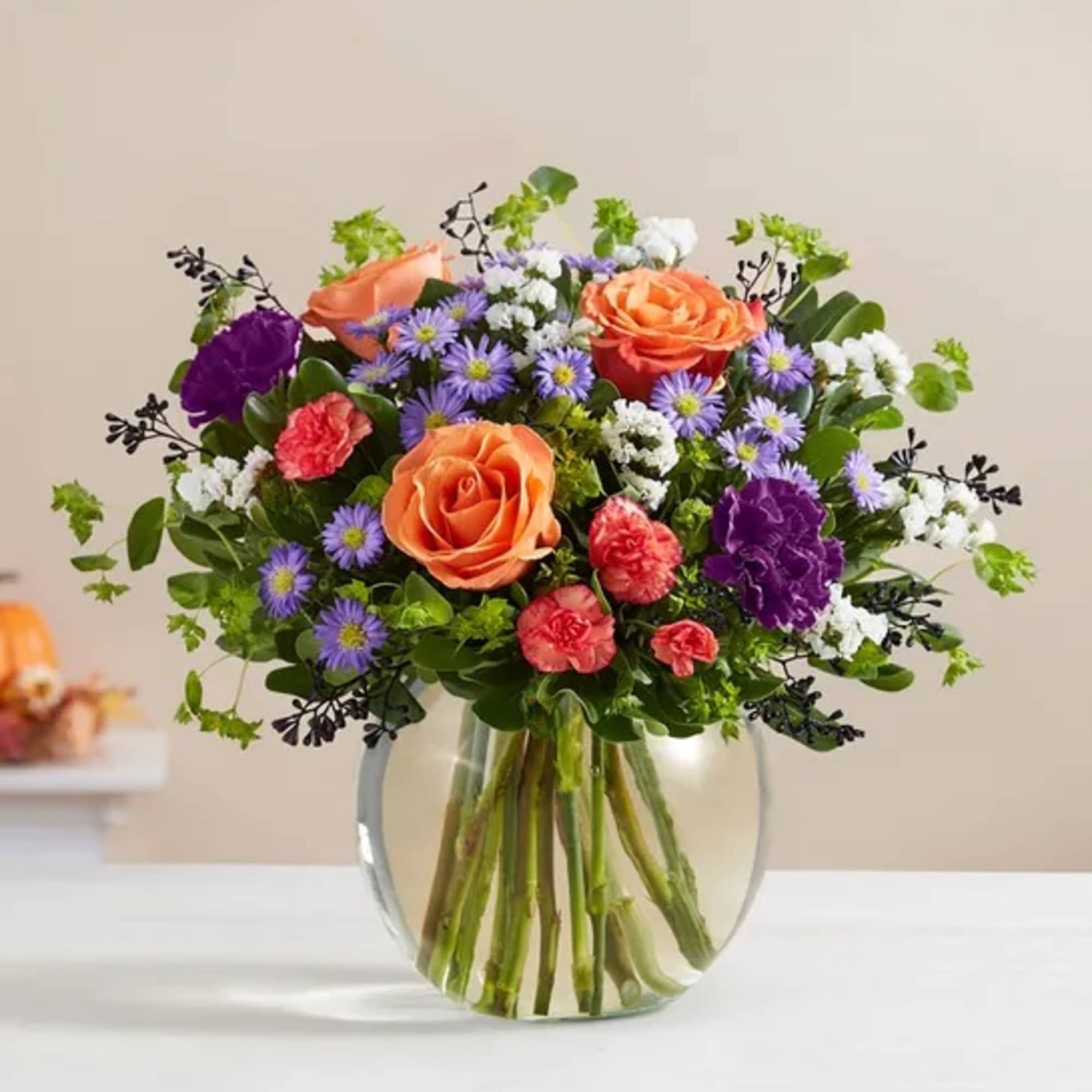Bubbling up from a cauldron-like bowl, our Halloween-hued blooms are a true