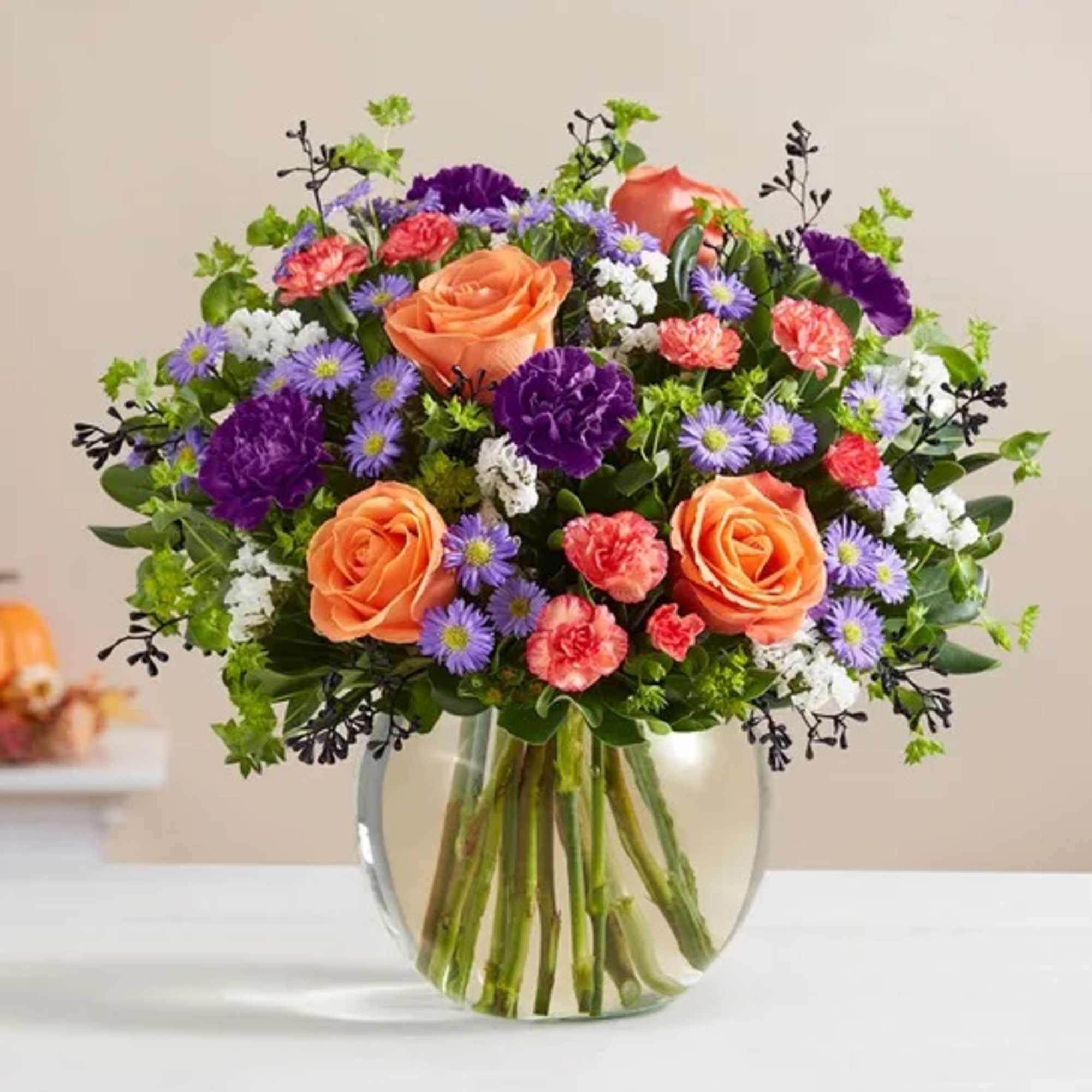 Bubbling up from a cauldron-like bowl, our Halloween-hued blooms are a true