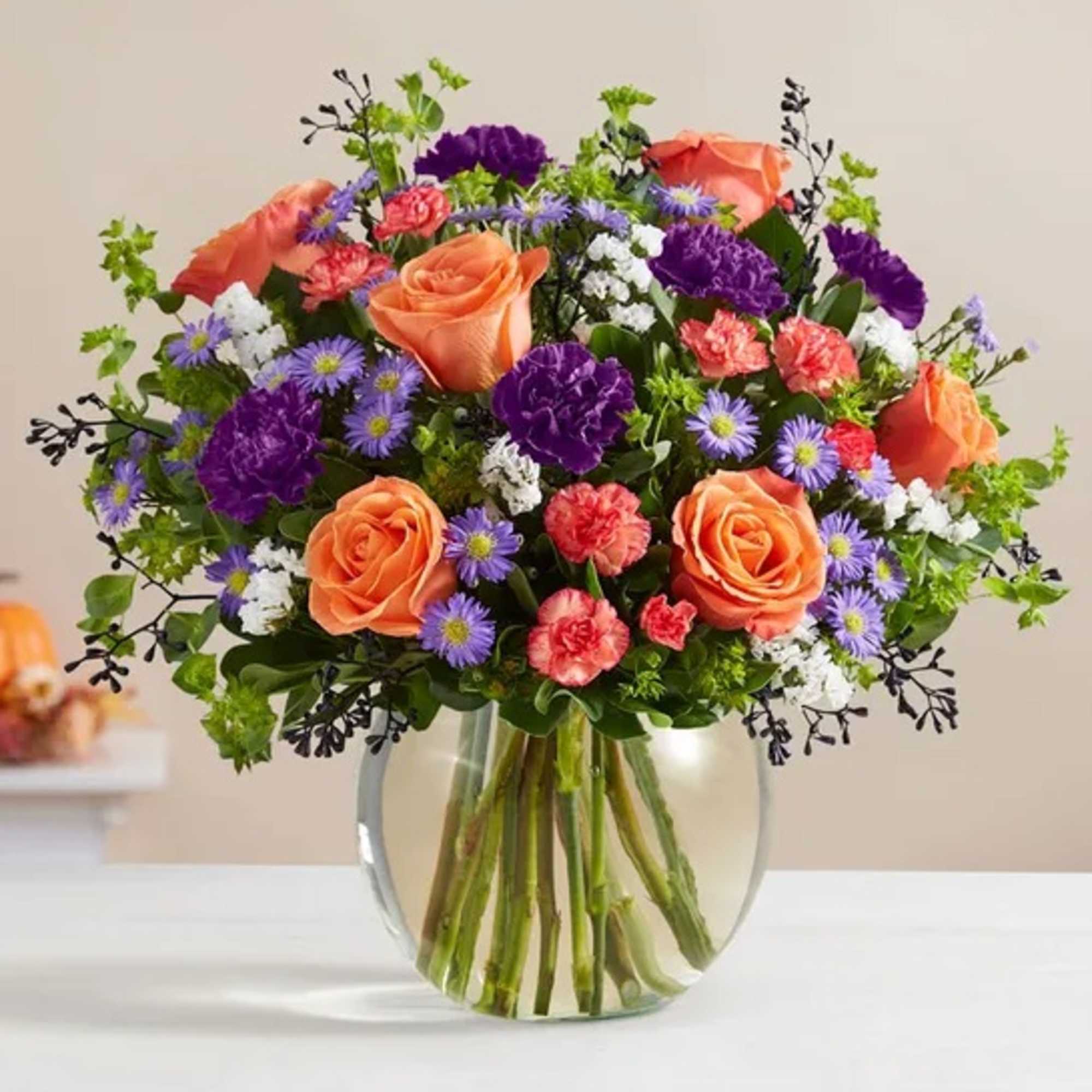 Bubbling up from a cauldron-like bowl, our Halloween-hued blooms are a true
