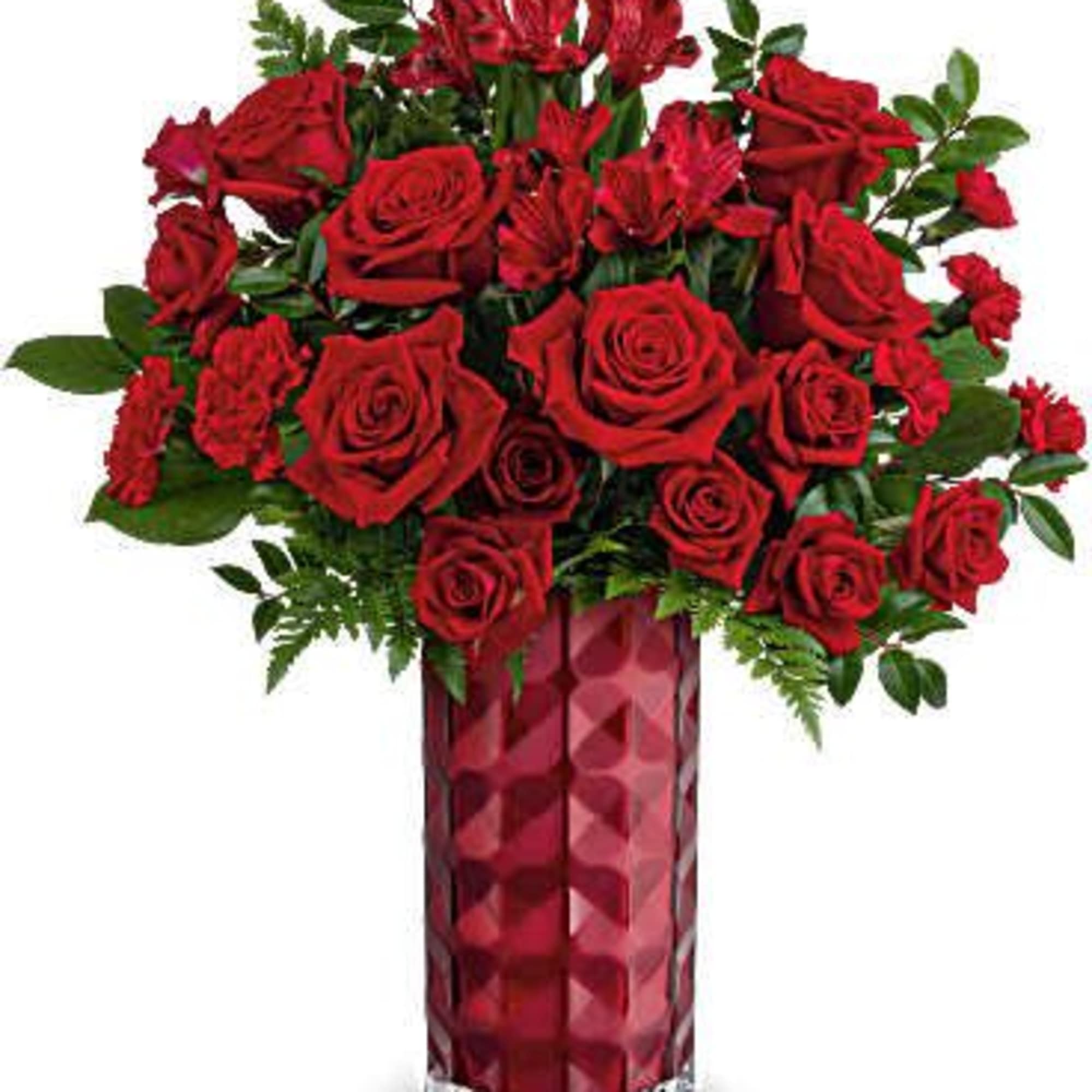 Red roses arranged in a tall red vase