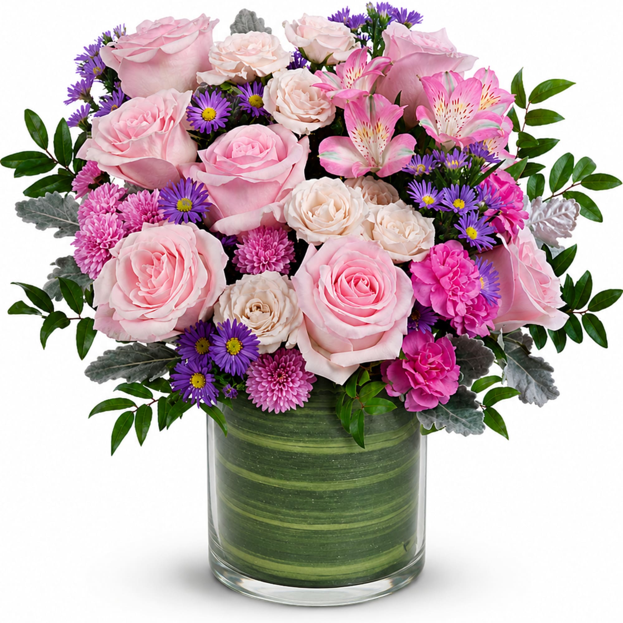 Pink roses and purple daisies in a green glass vase