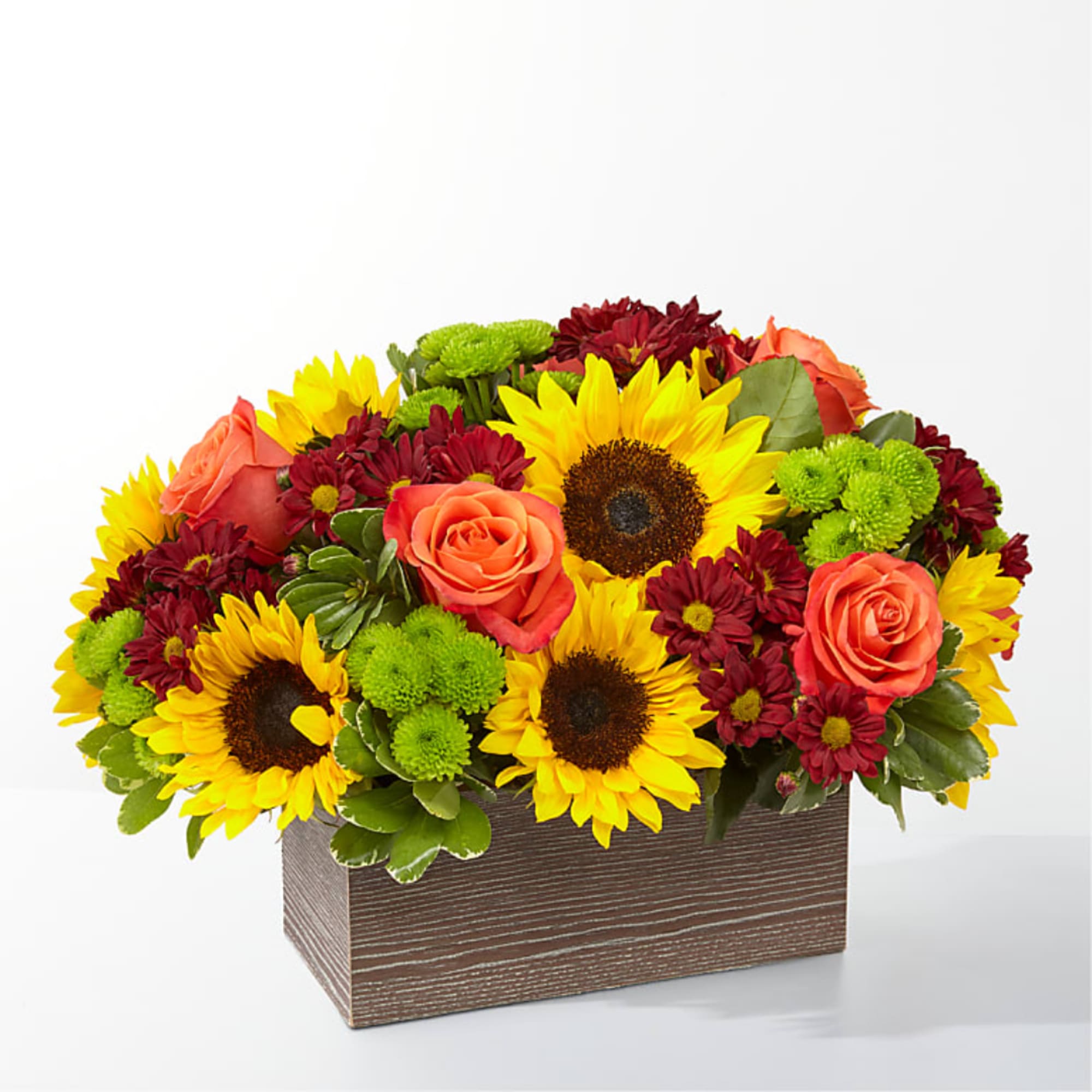 Sunflowers, orange roses, and burgundy mums in a rectangular wooden box