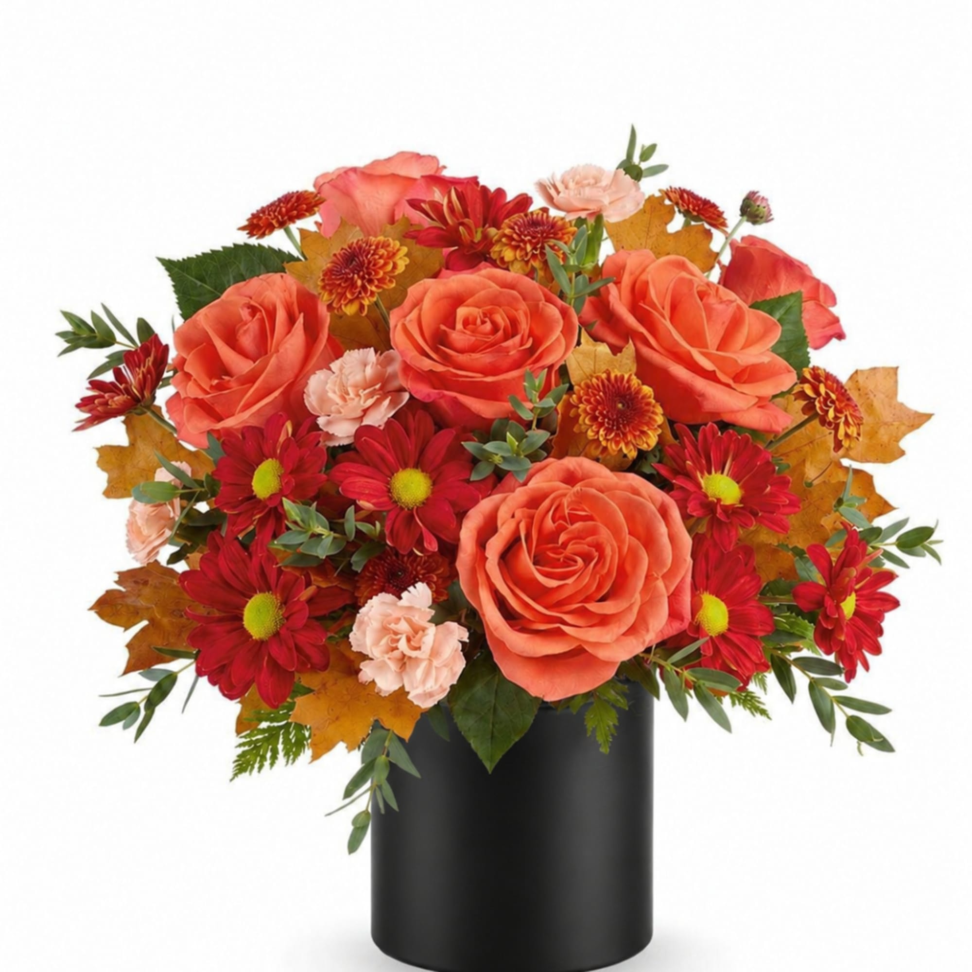Orange roses and red mums arranged in a black vase