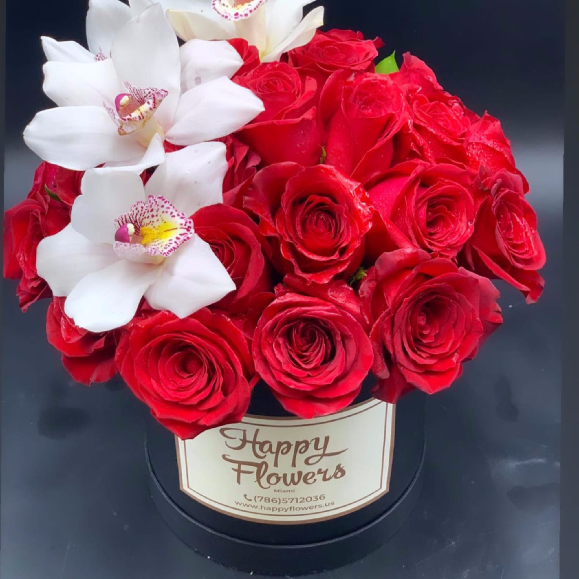 Red roses with white orchids in a black hat box, photo 4 of 4