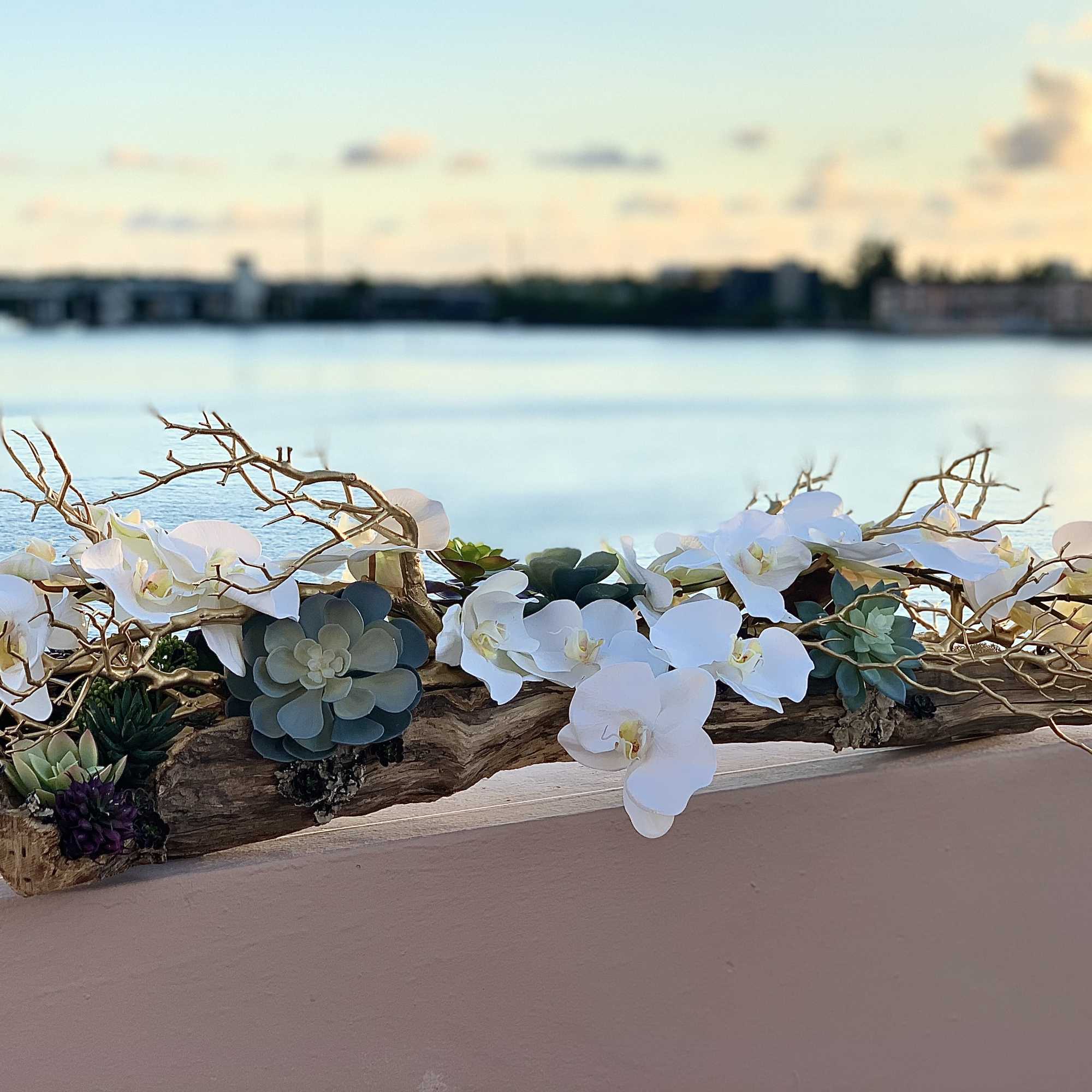 Silk orchids with golden driftwoods and succulents. Custom made. Beautiful decor for
