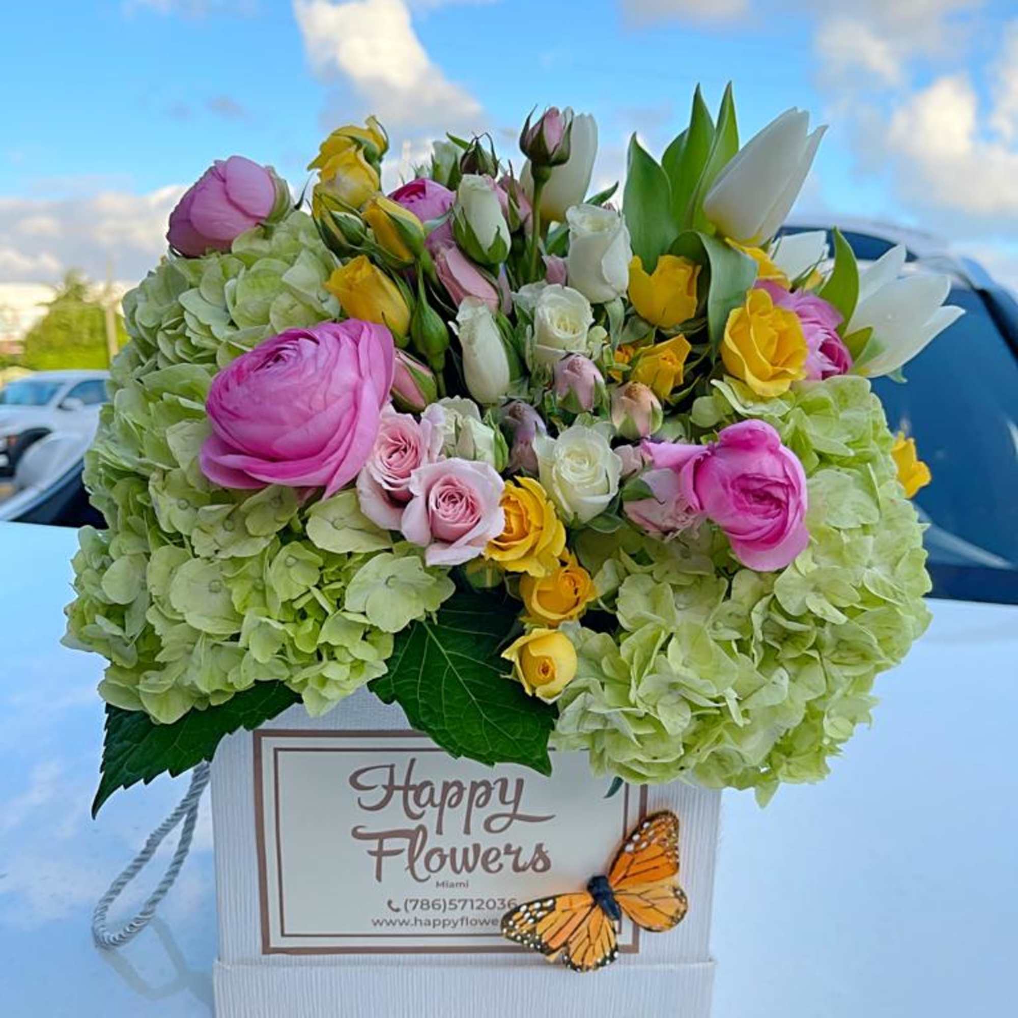 Beautiful flowers mix in a box. Hydrangea, tulips, spray roses and other, photo 2 of 2