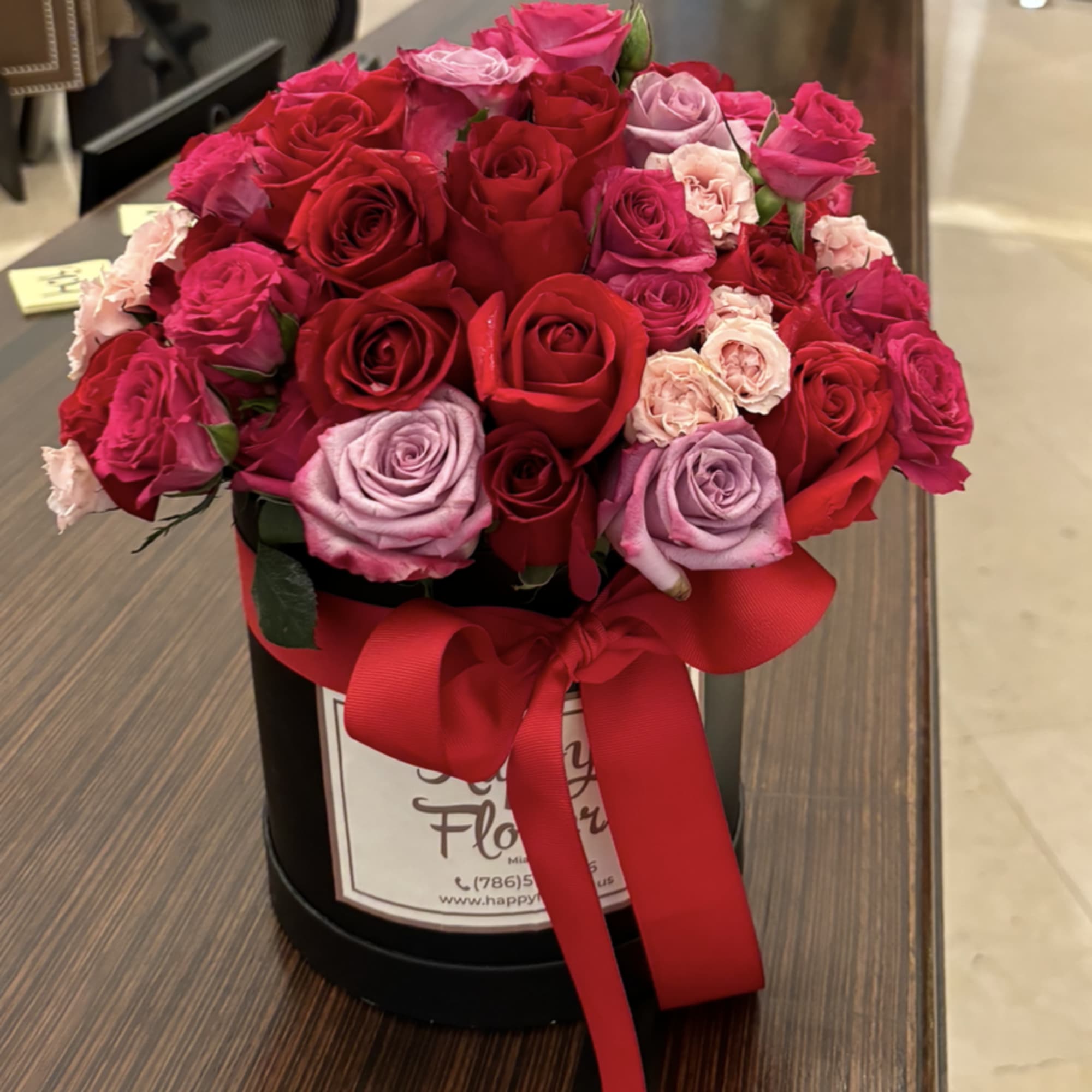 Mix of roses ( red, pink, purple) on a hat box