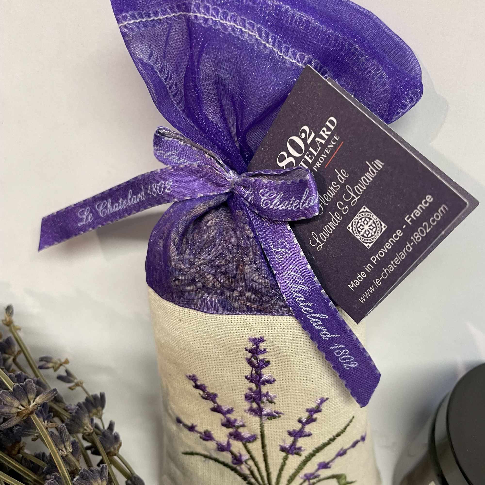 Lavender sachet bag tied with a purple ribbon and tag