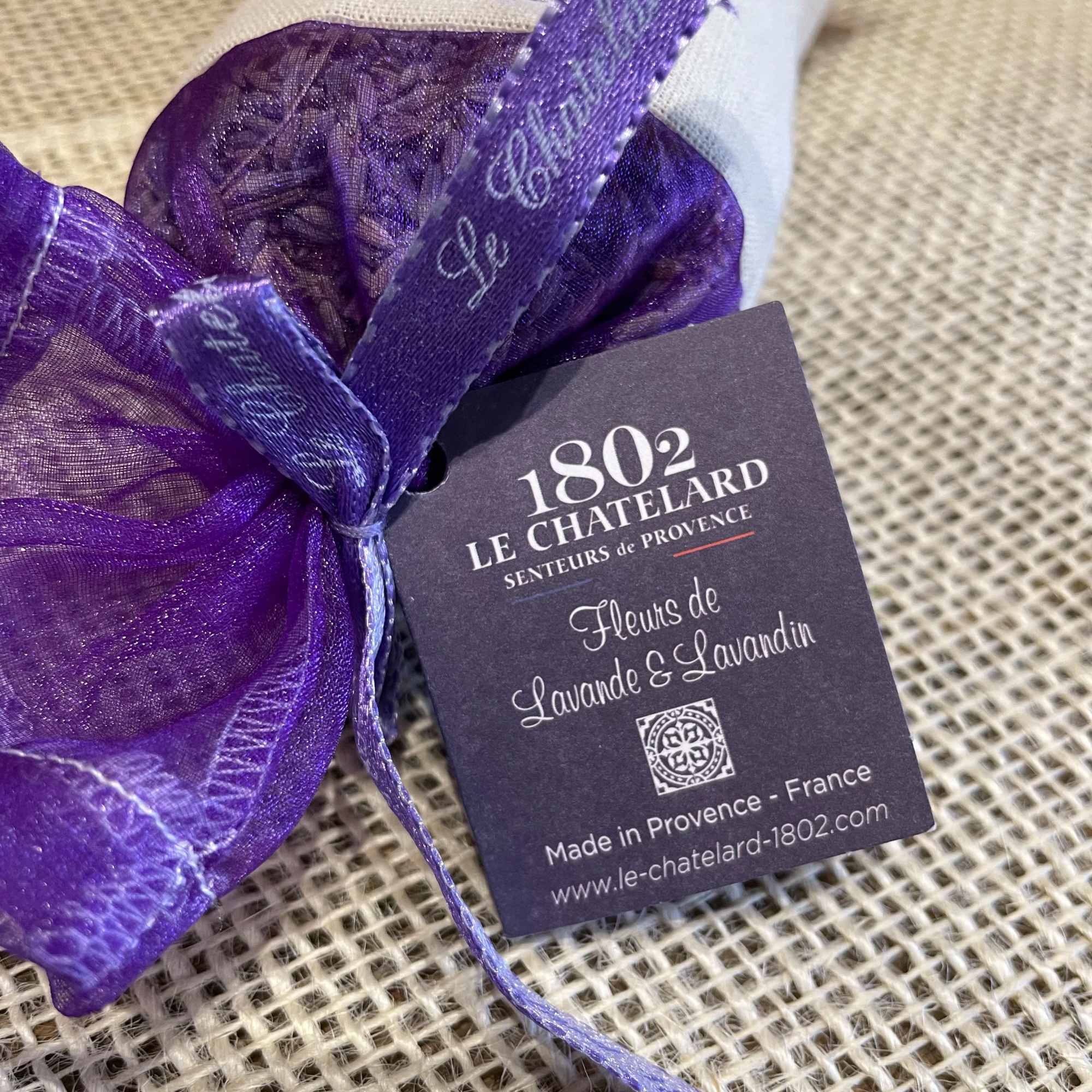 Purple organza sachet with a lavender-themed tag