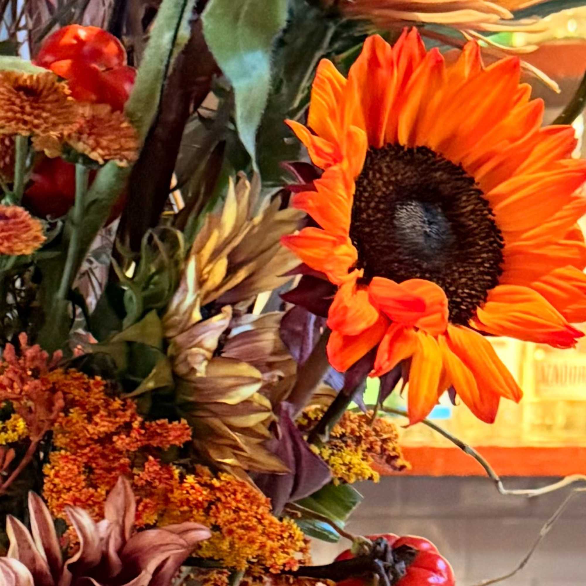 Autumn bouquet with sunflowers and orange blooms