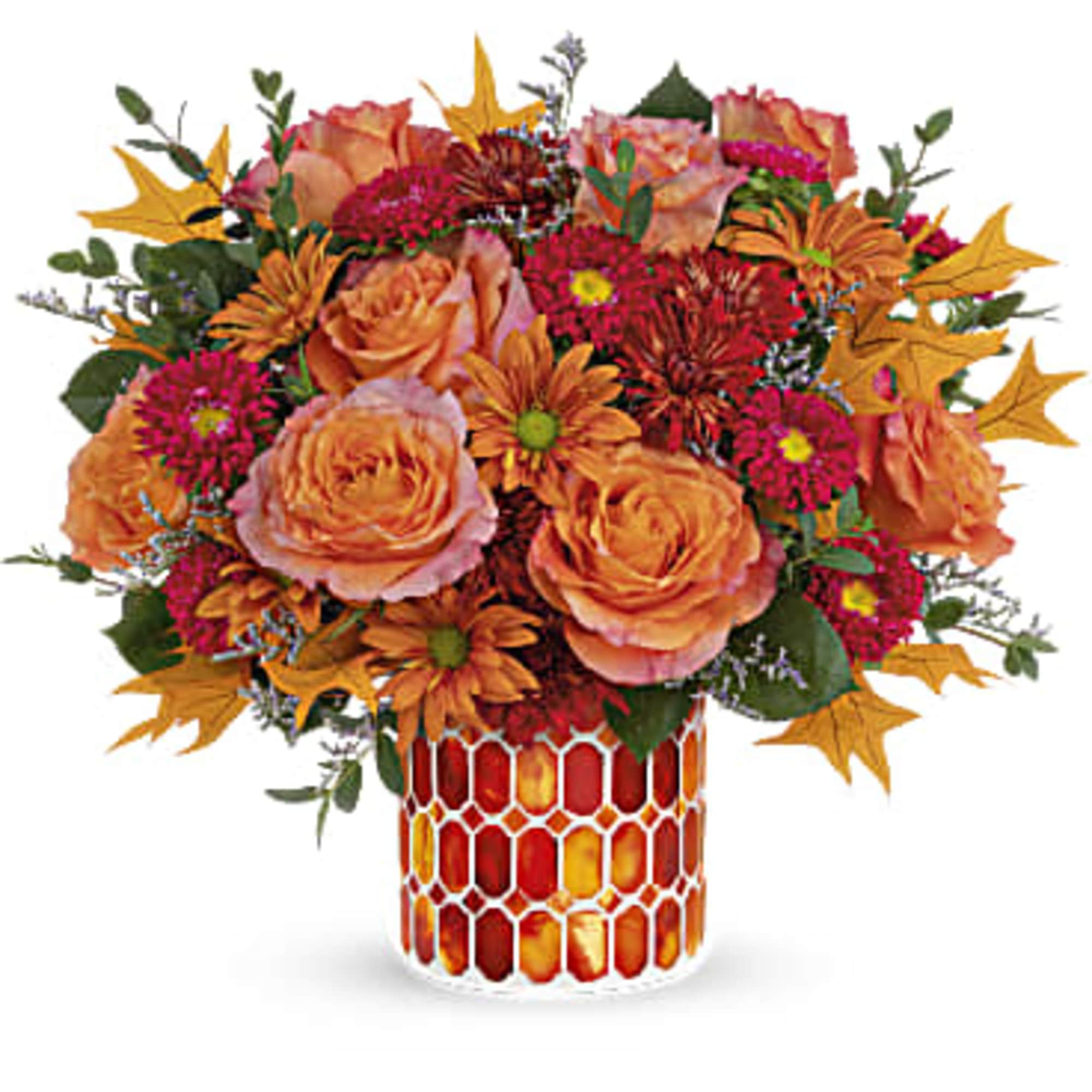 Artfully arranged in a beautiful keepsake vase of stained mosaic glass, this