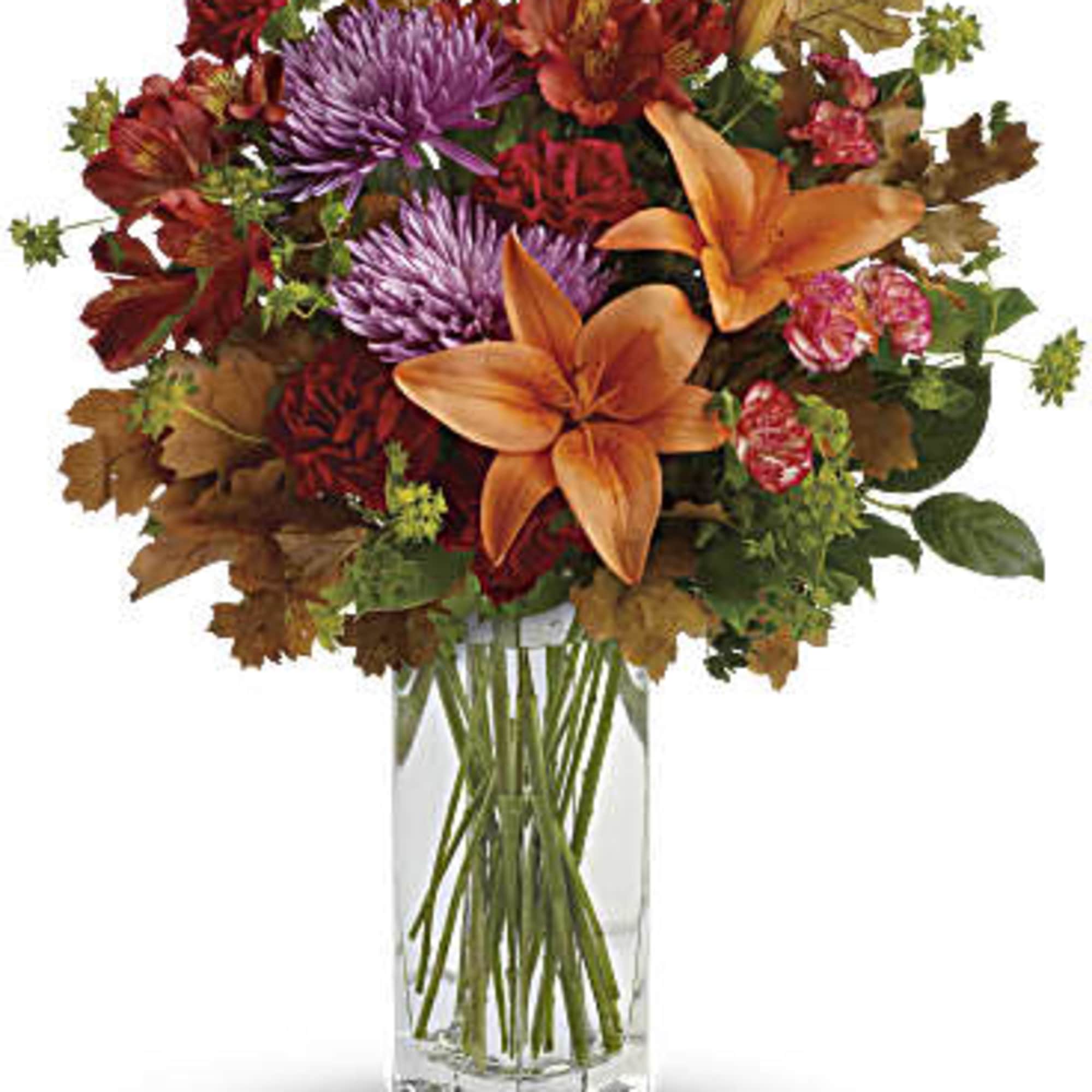 Brighten any fall day with this colorful array! Gorgeous orange lilies arranged