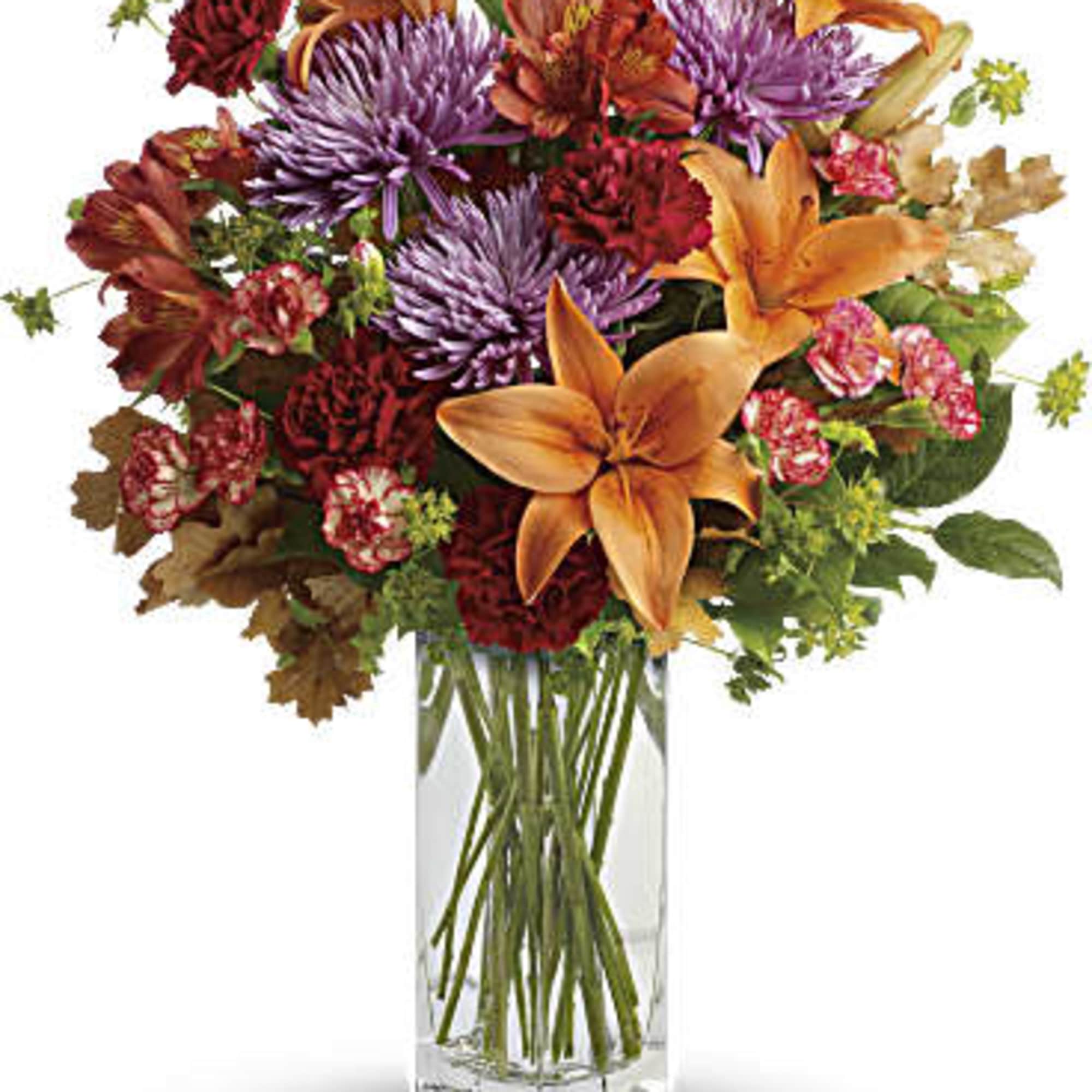 Brighten any fall day with this colorful array! Gorgeous orange lilies arranged