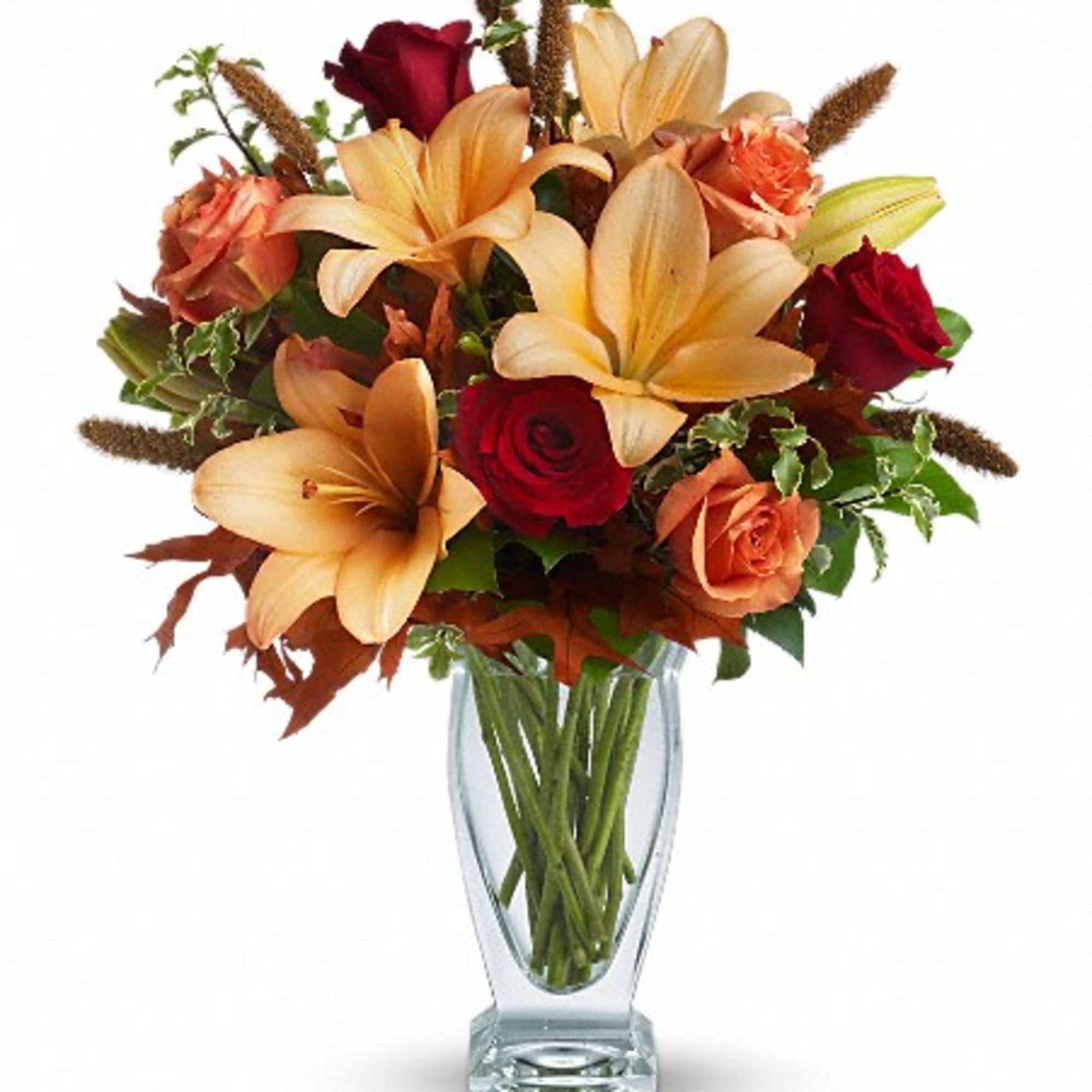 Roses, lilies, and oak leaves create a fantasy of fall colors. Send