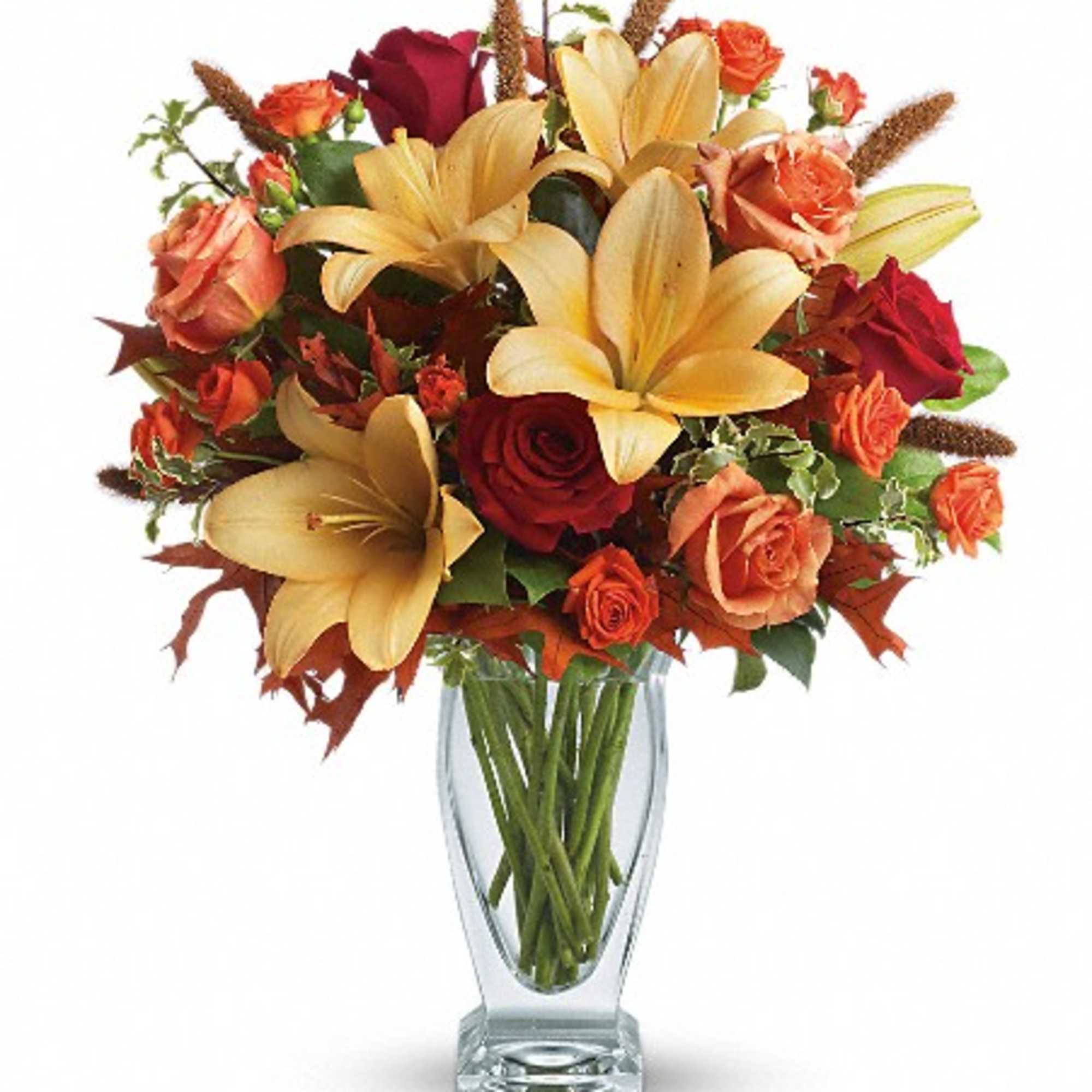 Roses, lilies, and oak leaves create a fantasy of fall colors. Send