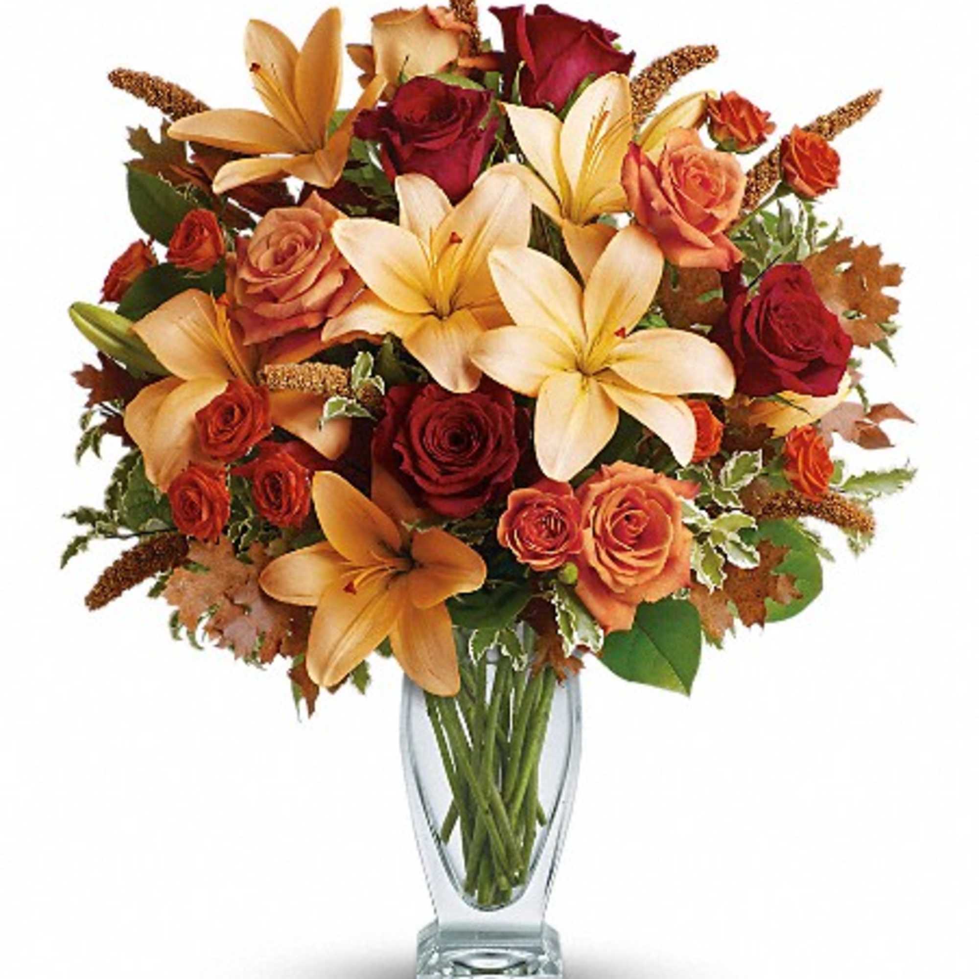 Roses, lilies, and oak leaves create a fantasy of fall colors. Send