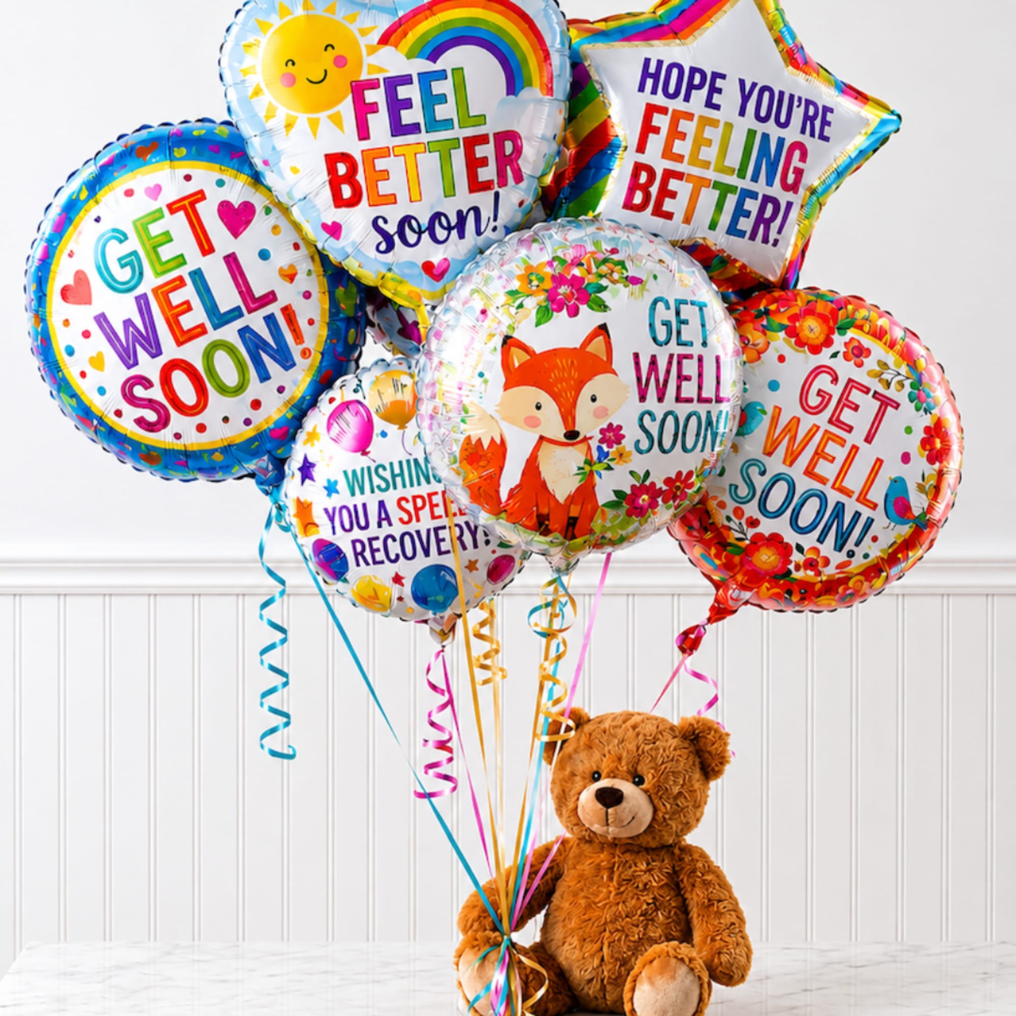 Get well balloons with a teddy bear on the floor