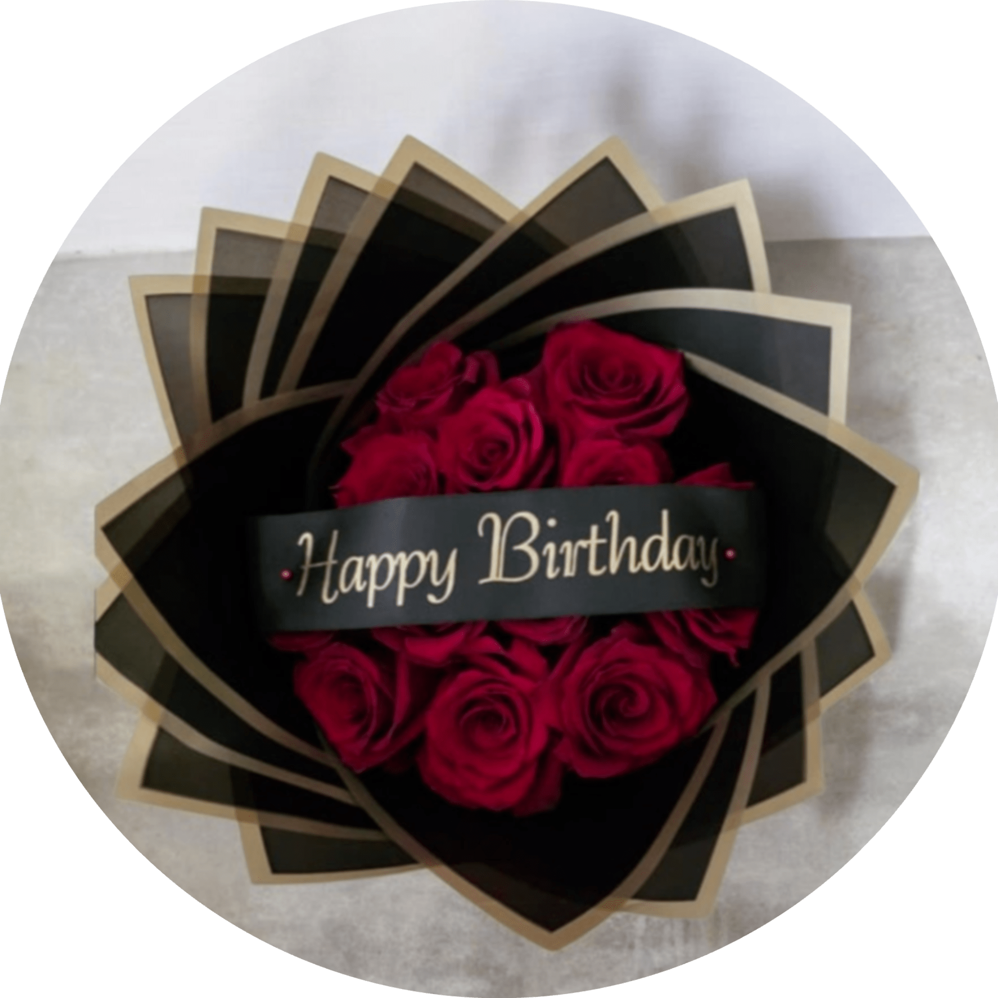 A dramatic cluster of deep red roses wrapped in sleek black packaging