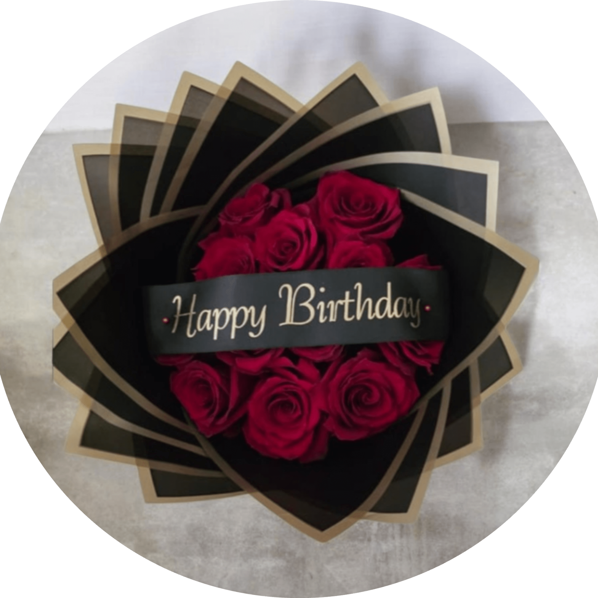 A dramatic cluster of deep red roses wrapped in sleek black packaging