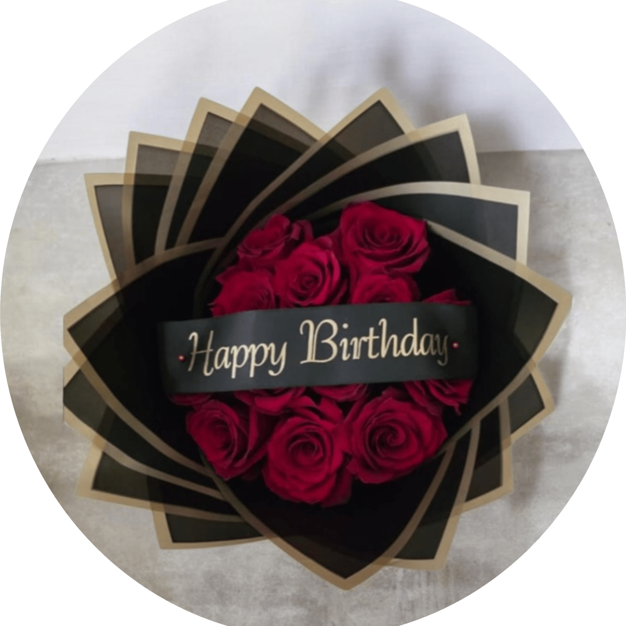 A dramatic cluster of deep red roses wrapped in sleek black packaging