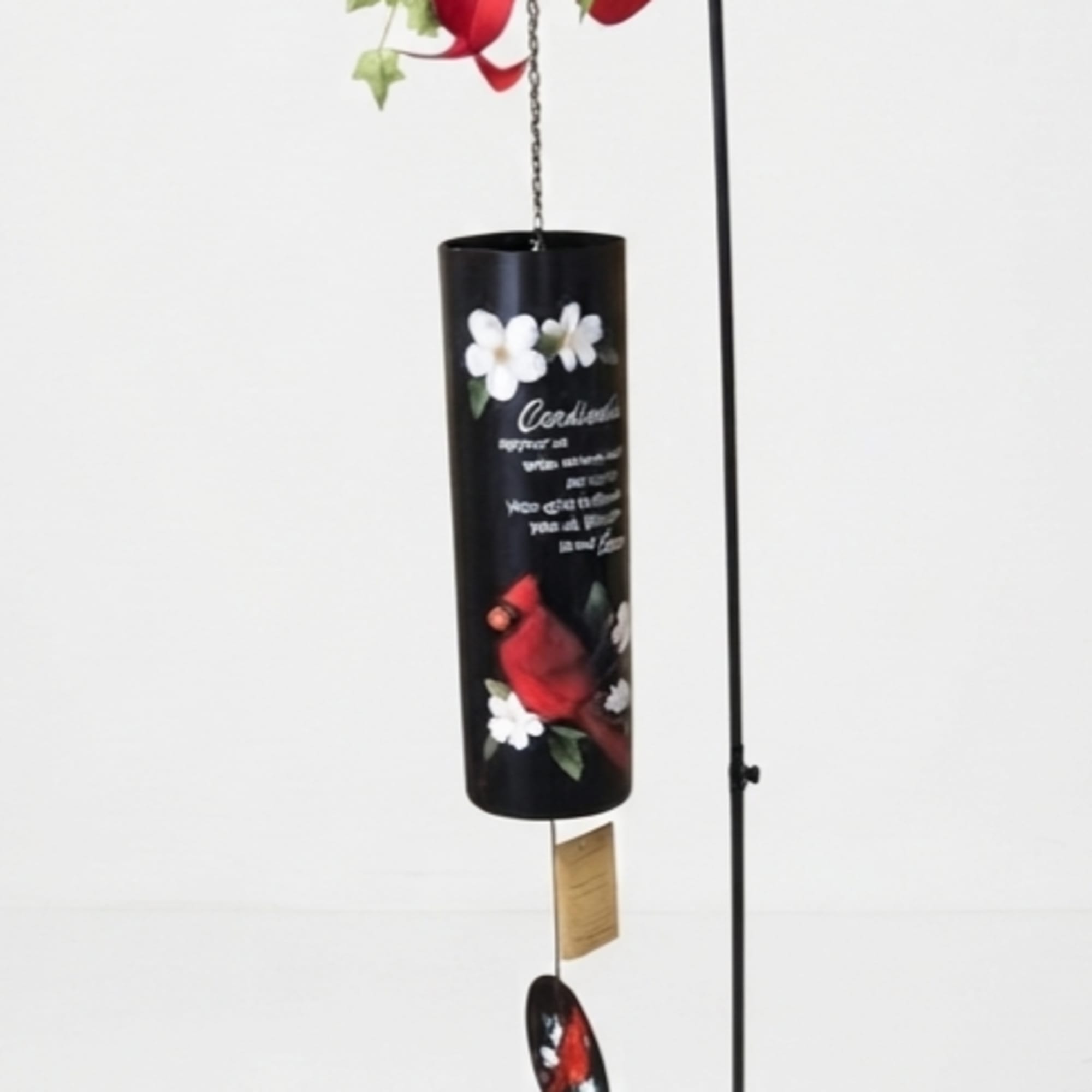 Hanging black candle holder with red bow and ivy decoration