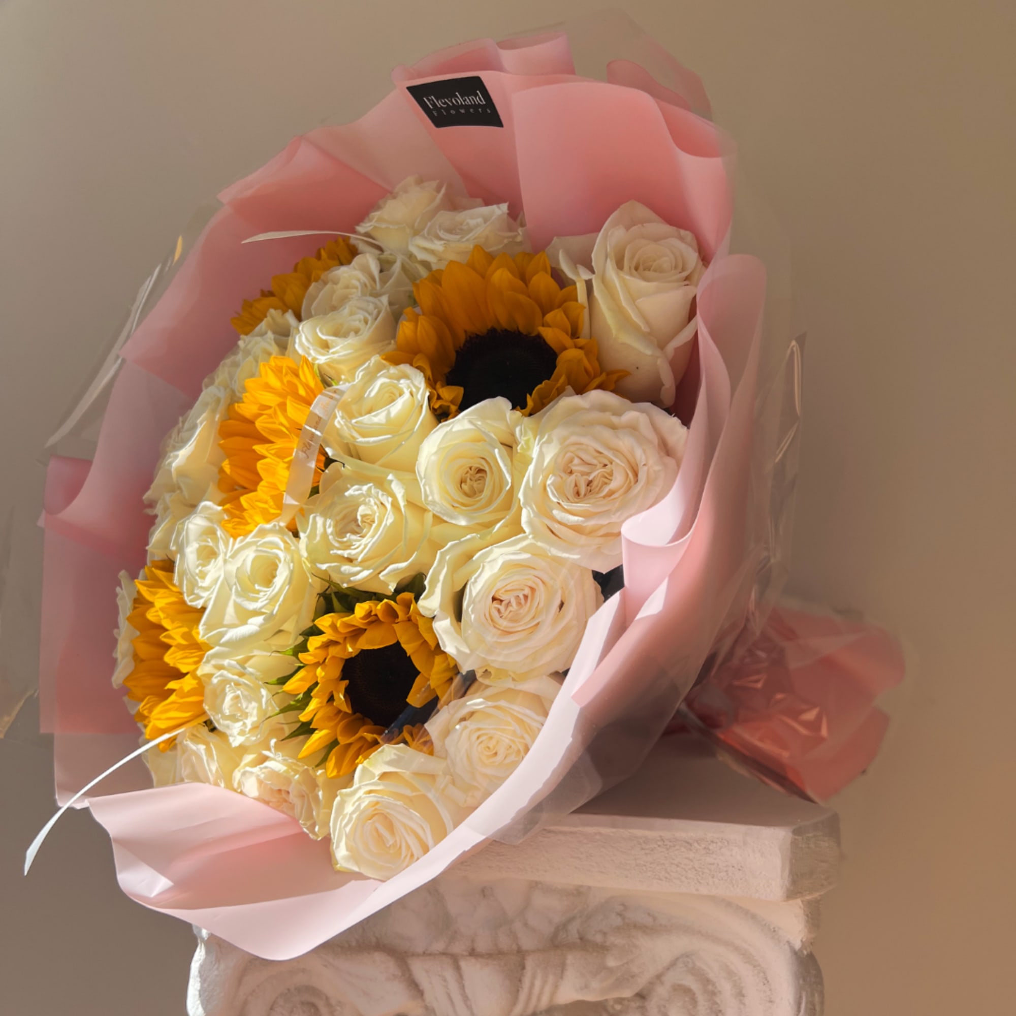 Bouquet of white roses and yellow sunflowers wrapped in pink paper, photo 2 of 3