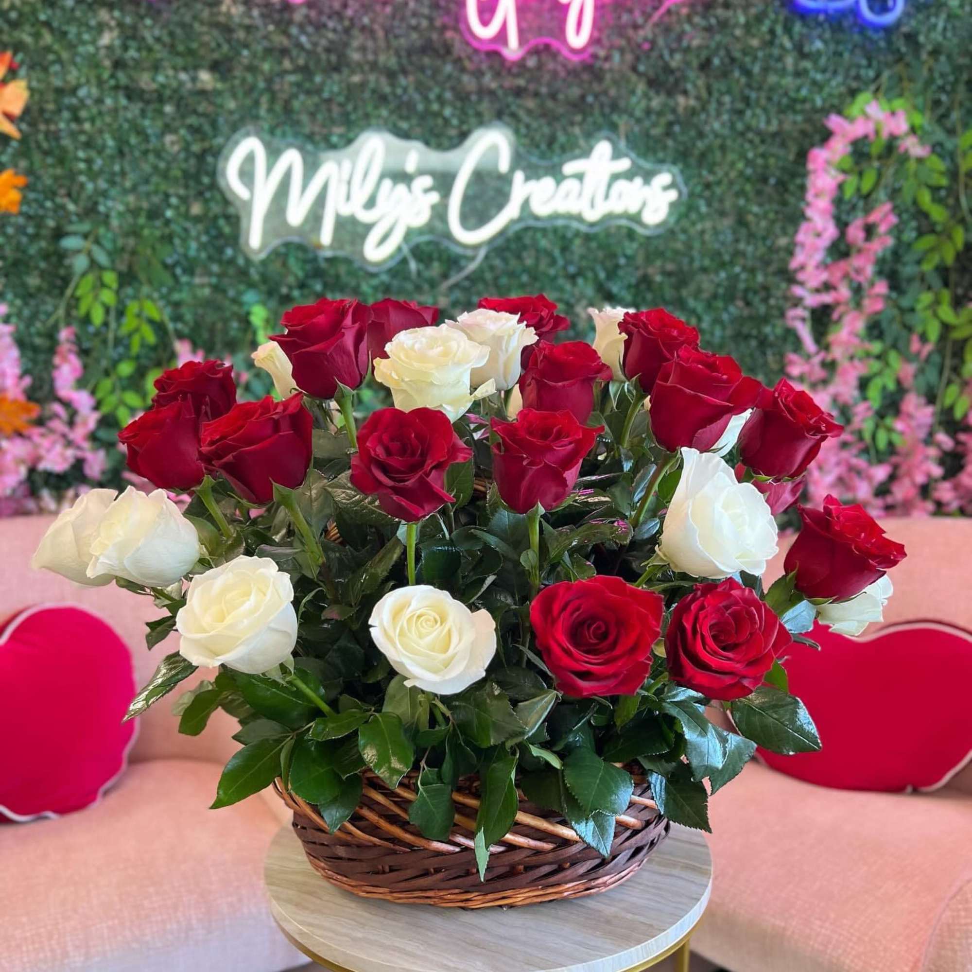Basket of red and white roses on a table