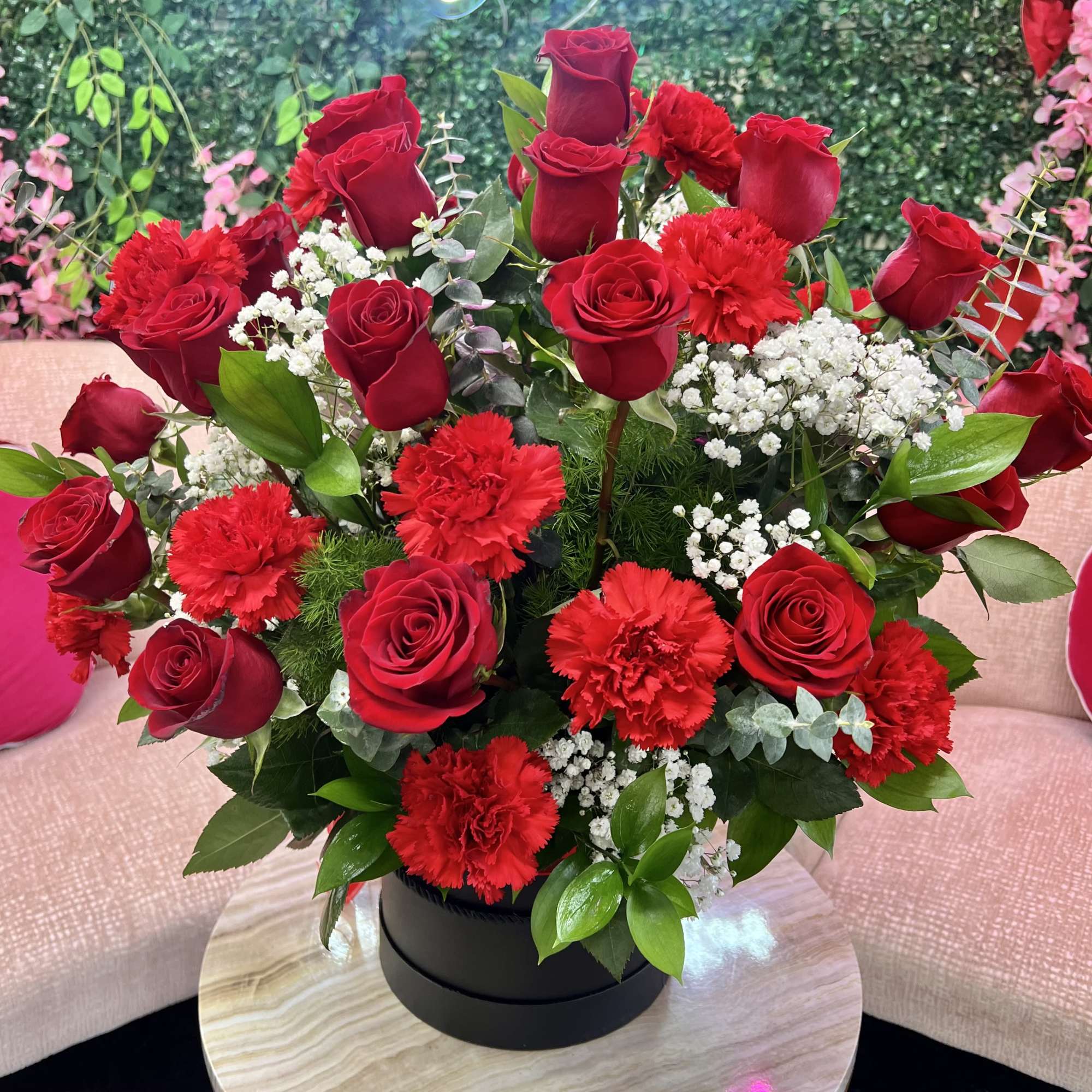 Red roses and carnations arranged in a black box, photo 2 of 2