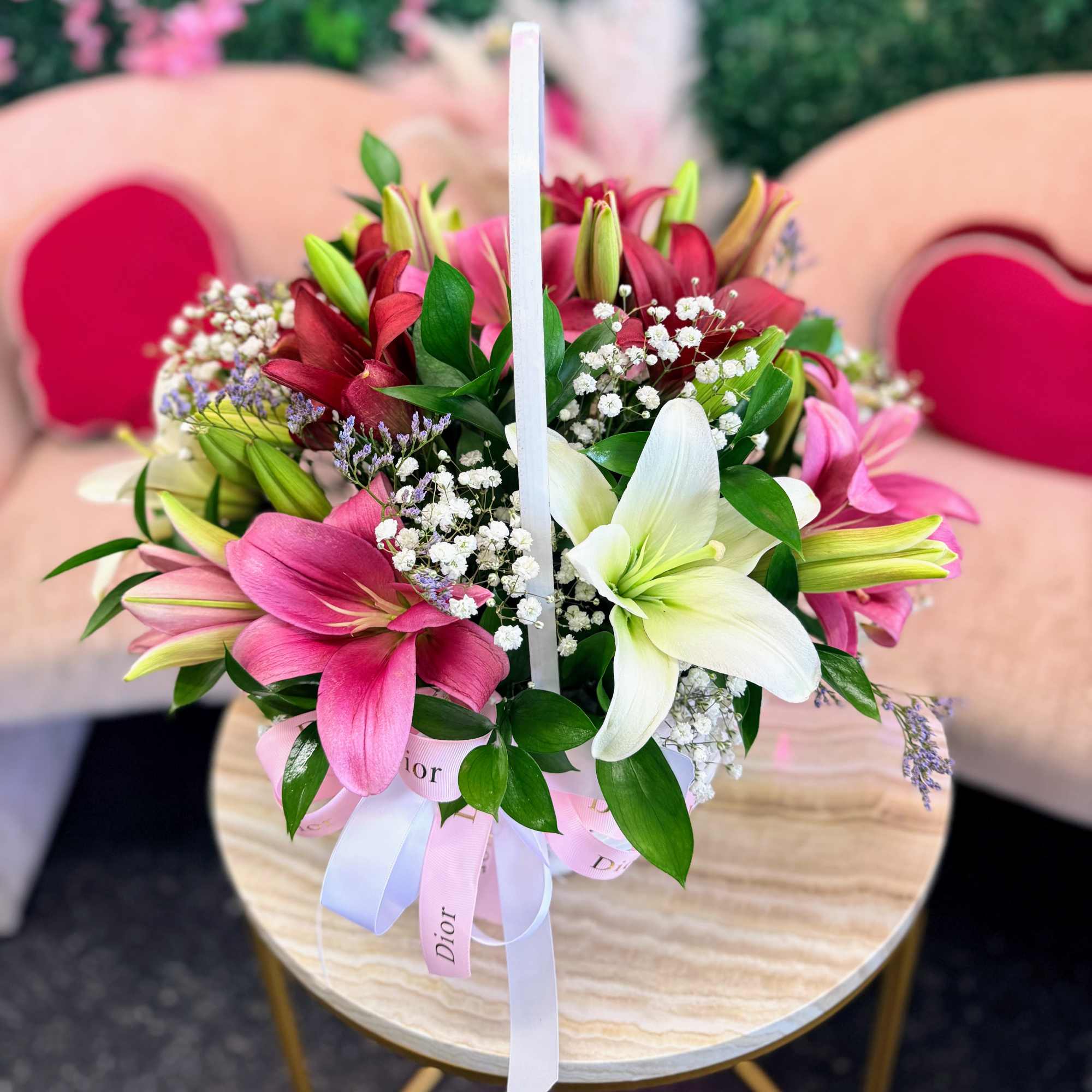 A charming wooden basket filled with a radiant mix of colorful lilies, photo 2 of 3