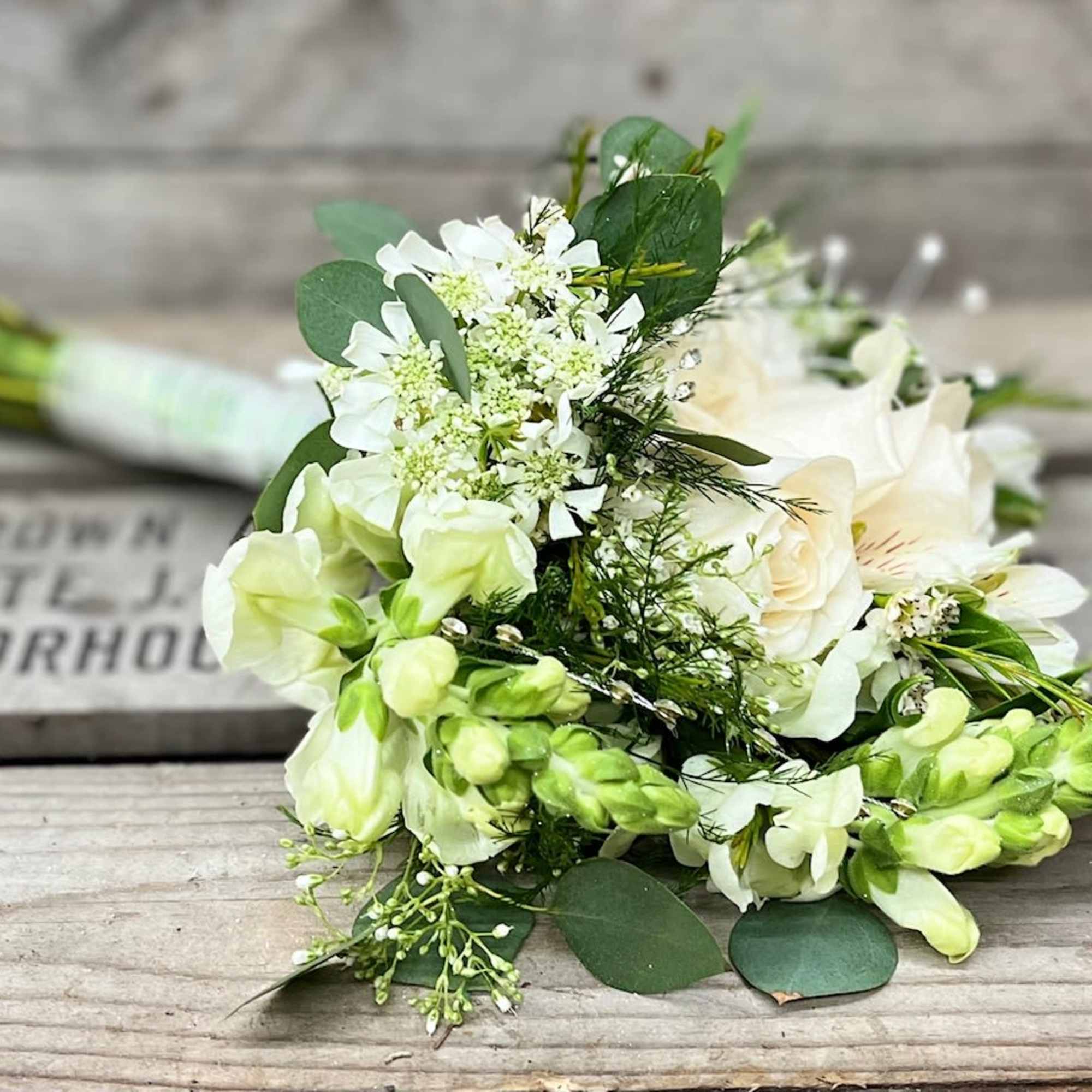 Mix of all white flowers arranged beautifully in small handheld handpicked look