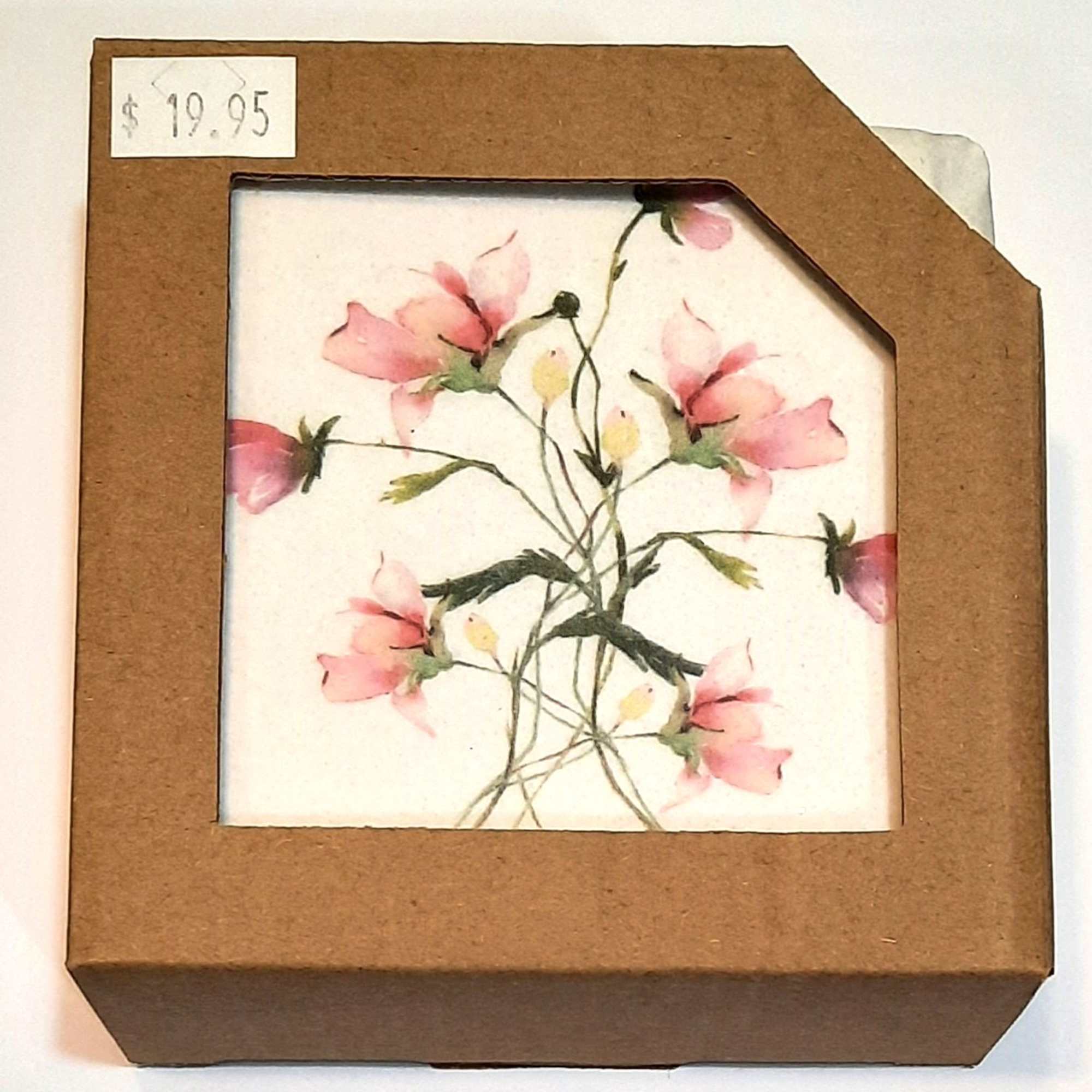 Pressed pink flowers in a brown cardboard frame