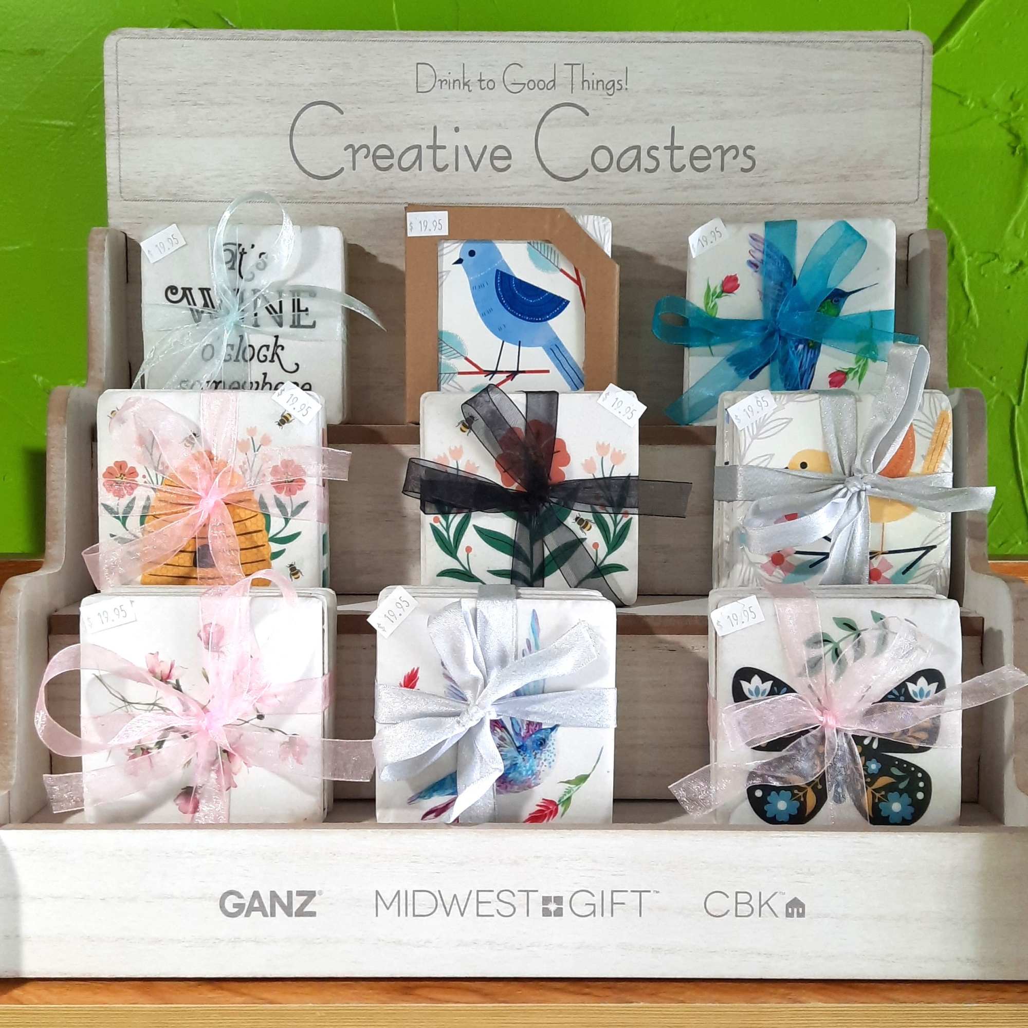 Decorative coasters tied with ribbons on a display rack