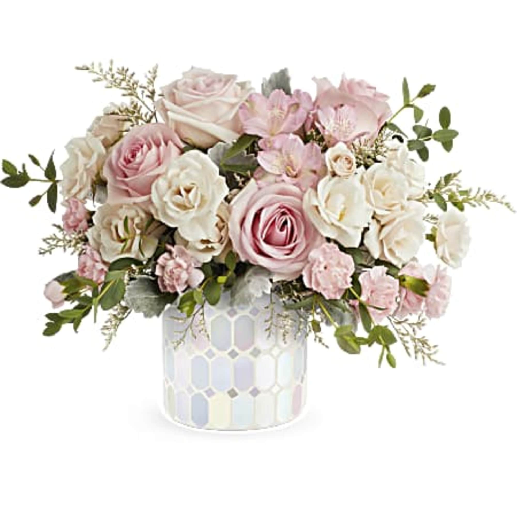 Pink and white rose bouquet in a patterned ceramic vase