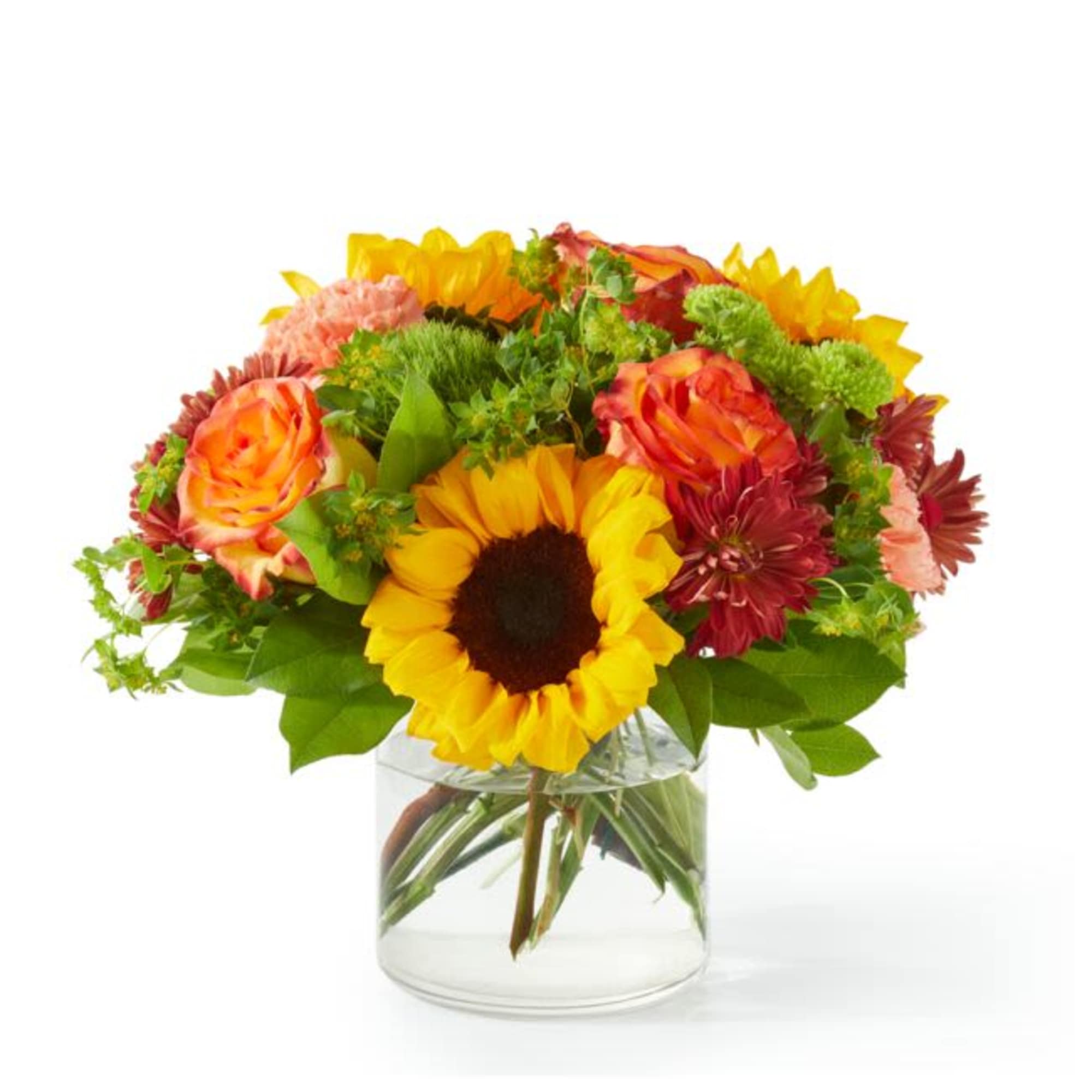 Mixed bouquet with sunflowers, roses, and chrysanthemums in a clear glass vase