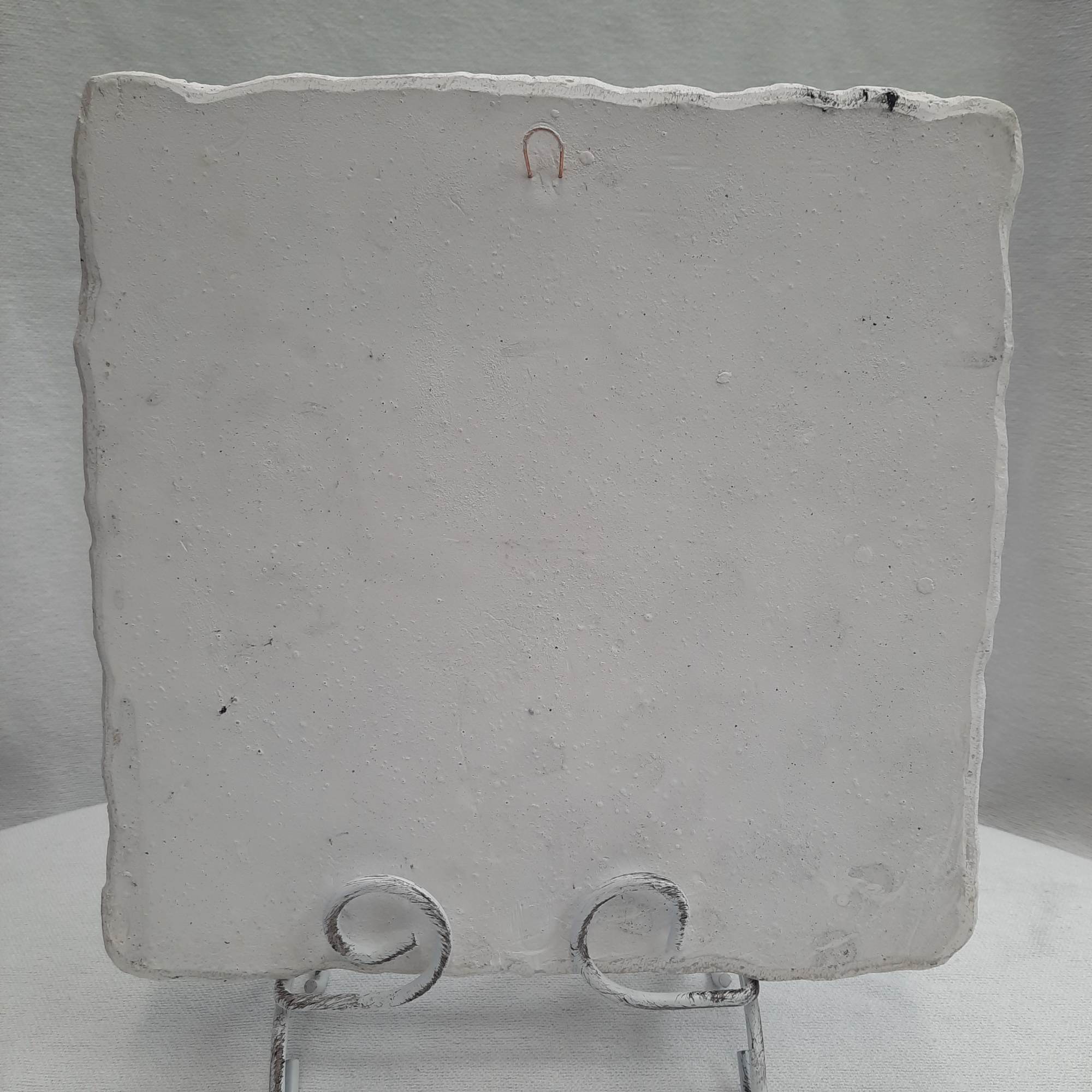 Blank square white ceramic plaque on a metal stand