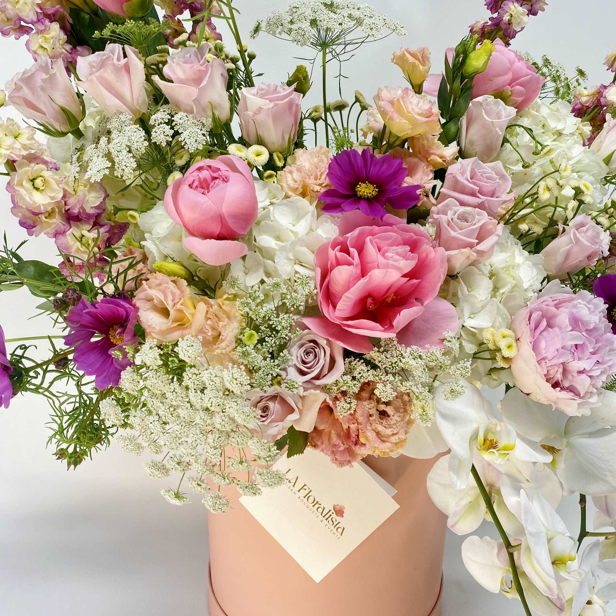 Mixed pink and white bouquet in a blush round box